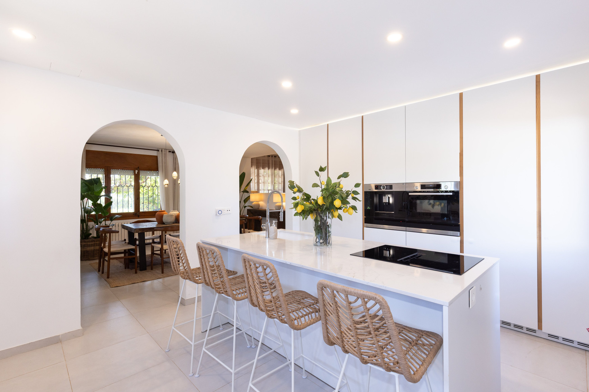 Open kitchen with island and arches