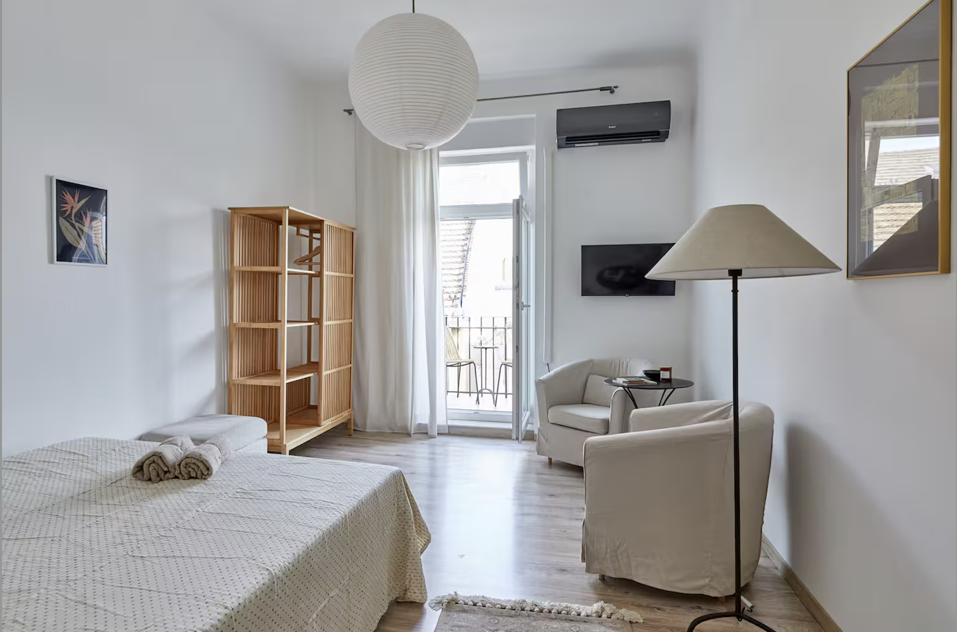 Bedroom with seating and balcony access