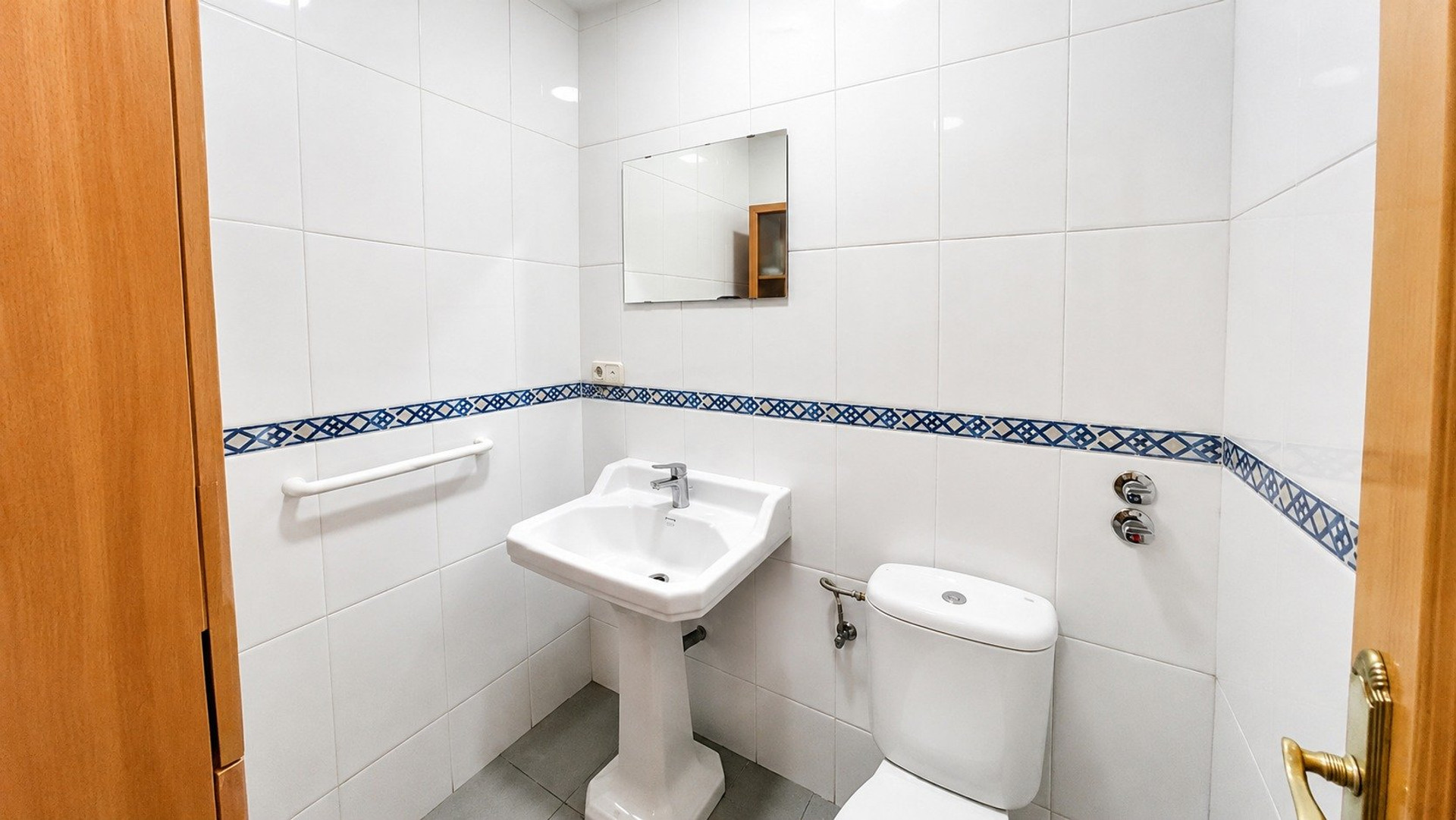 Bathroom with sink and toilet