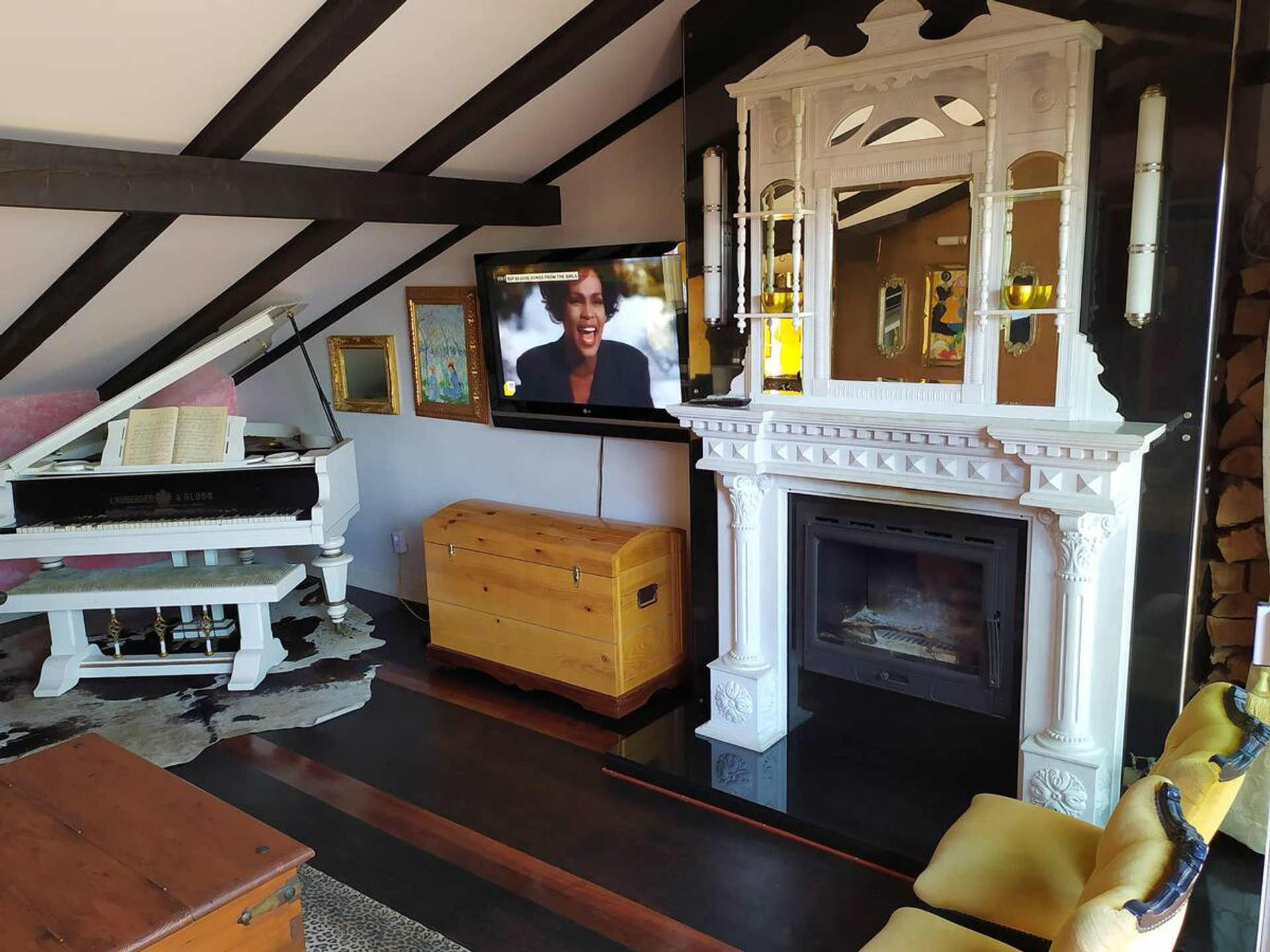 Living room fireplace with grand piano
