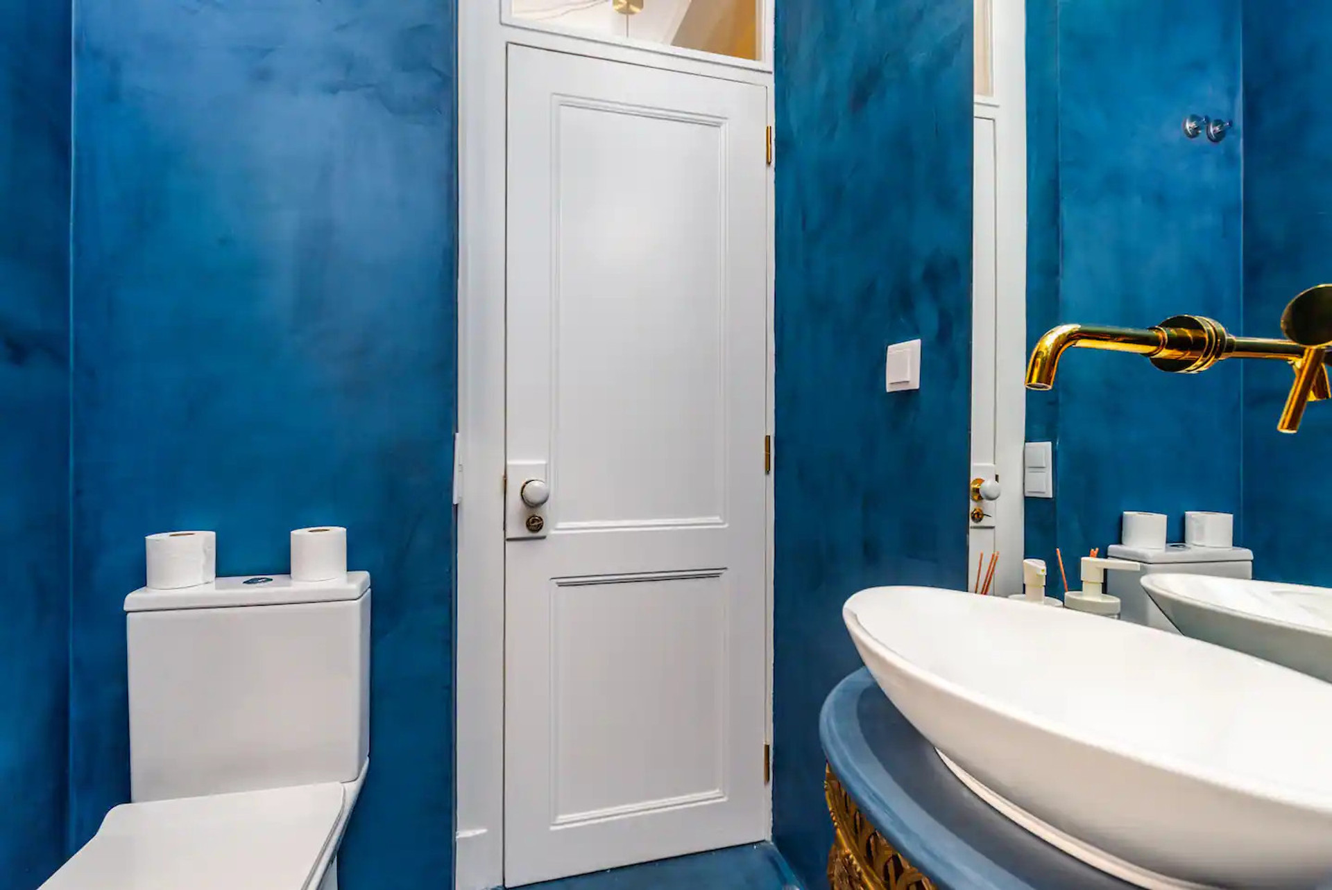 Blue bathroom toilet gold faucet