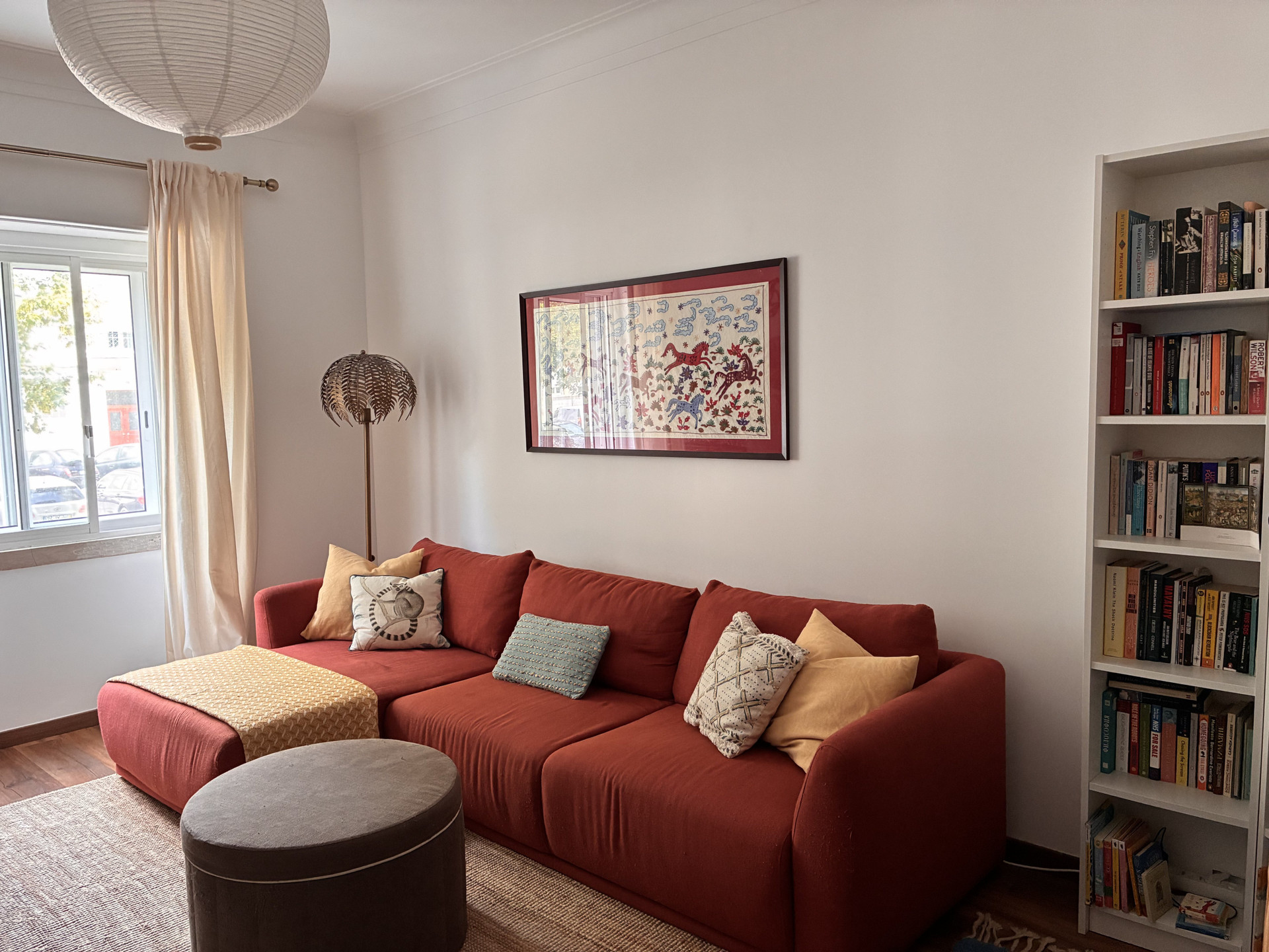 Living room with red sofa bookshelf