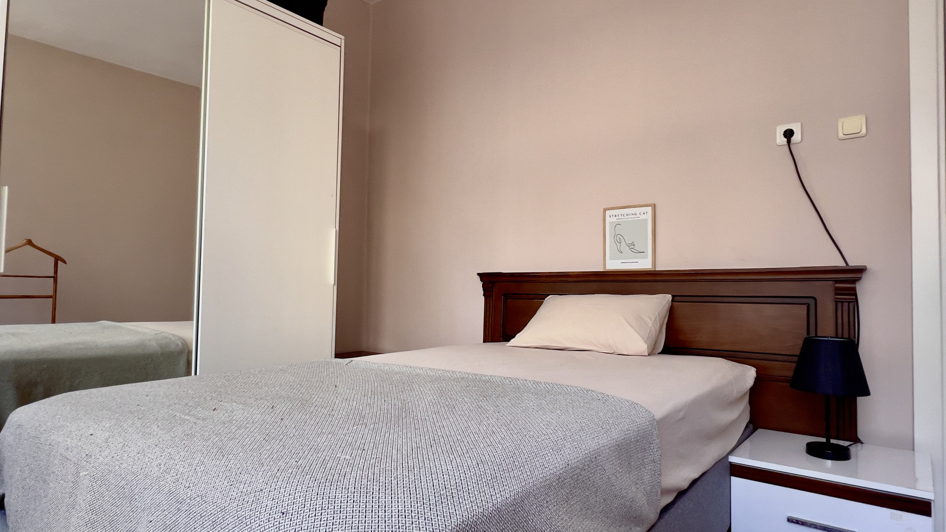 Cozy bedroom with wooden headboard