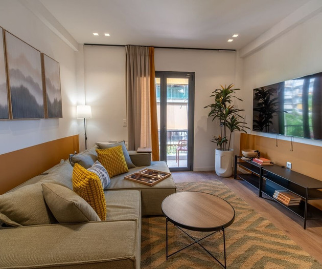 Living room with TV and balcony