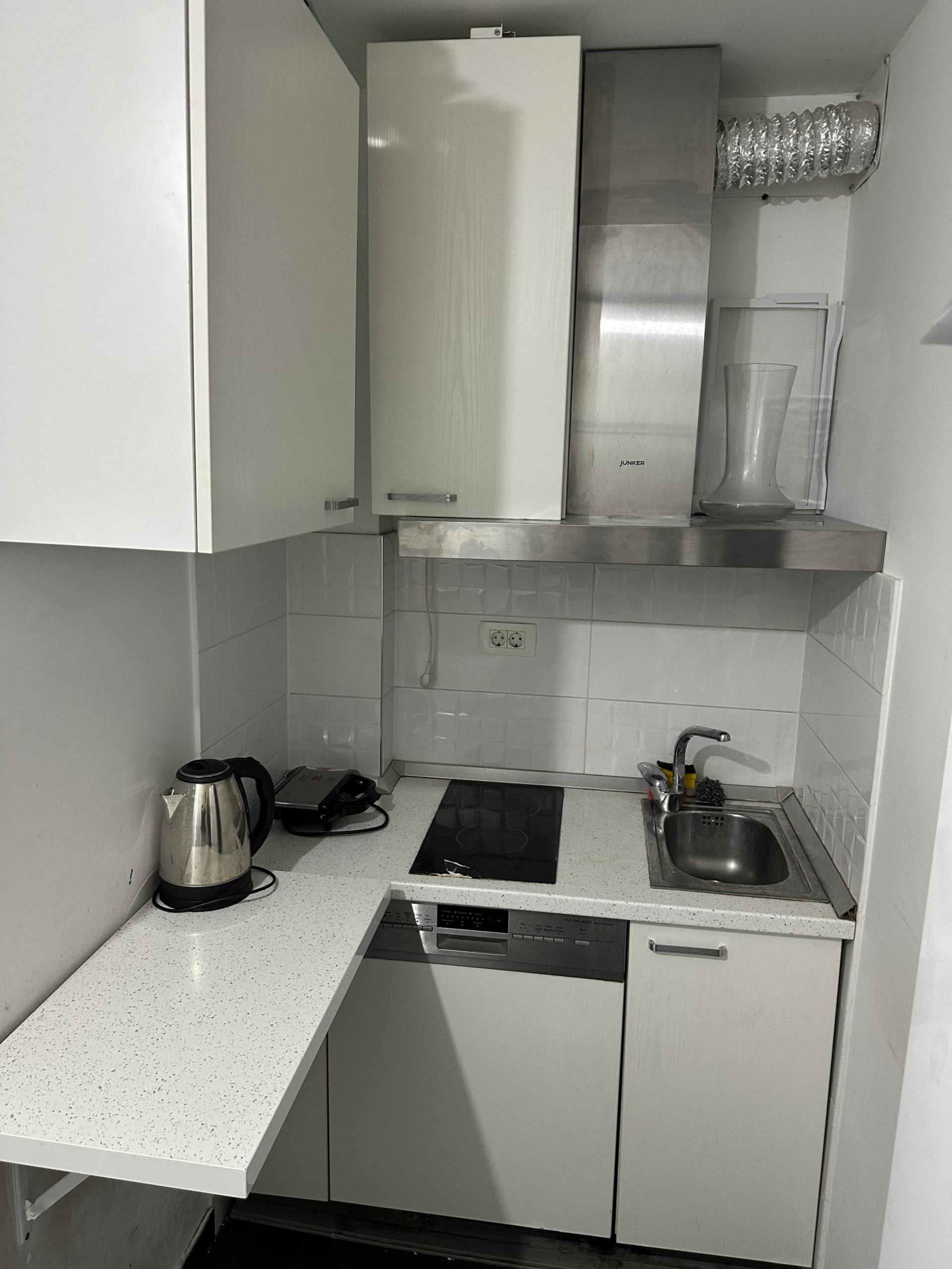 small kitchen located nearby the room