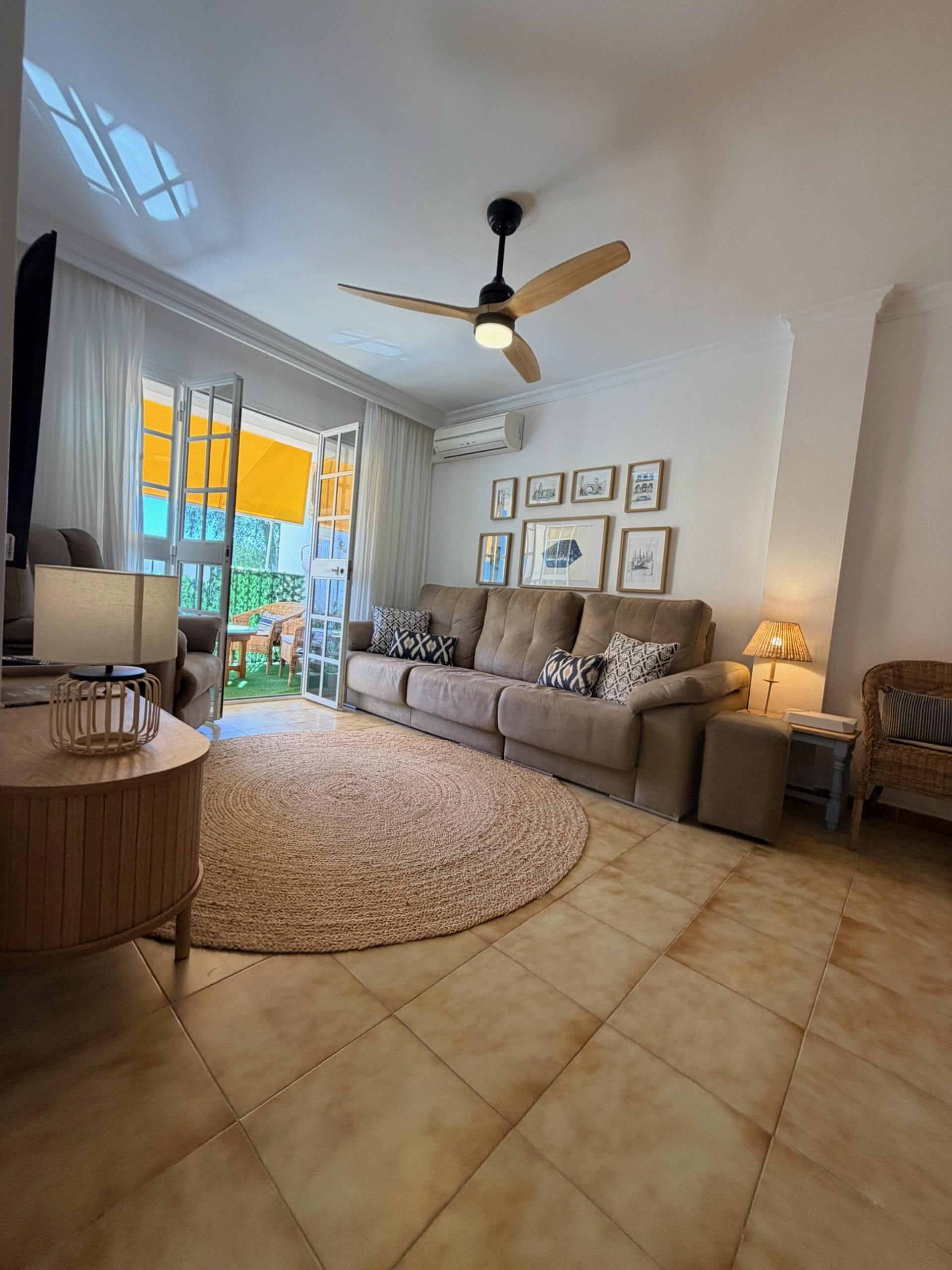 Living room with sofa and balcony access