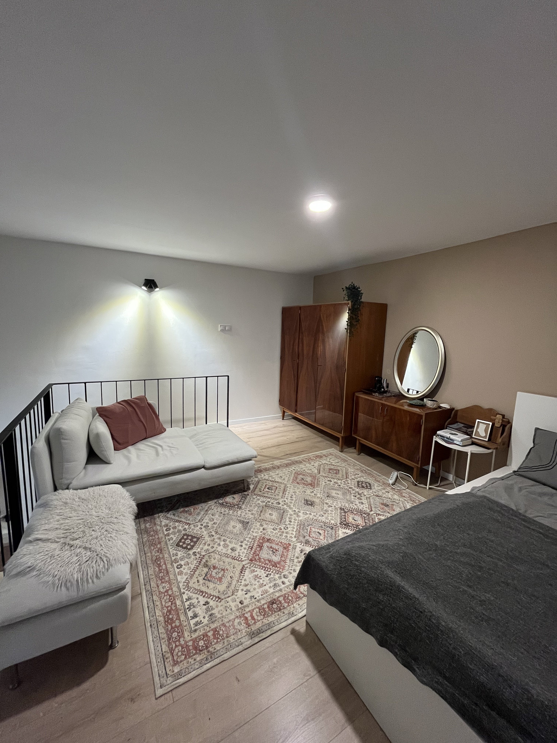 Loft bedroom with sofa seating
