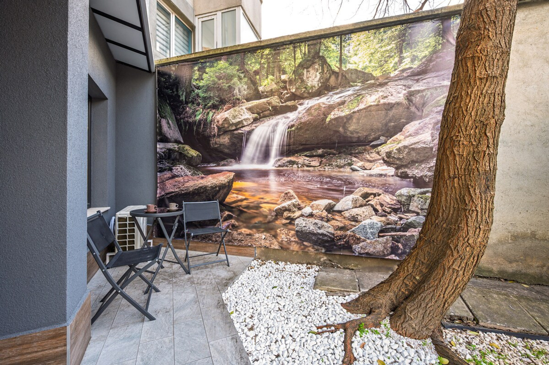 A cozy corner of the shared patio, thoughtfully decorated with nature-inspired elements for peaceful moments.
