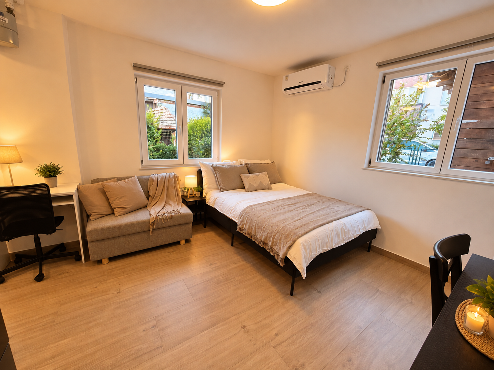 Bedroom area with sofa and desk