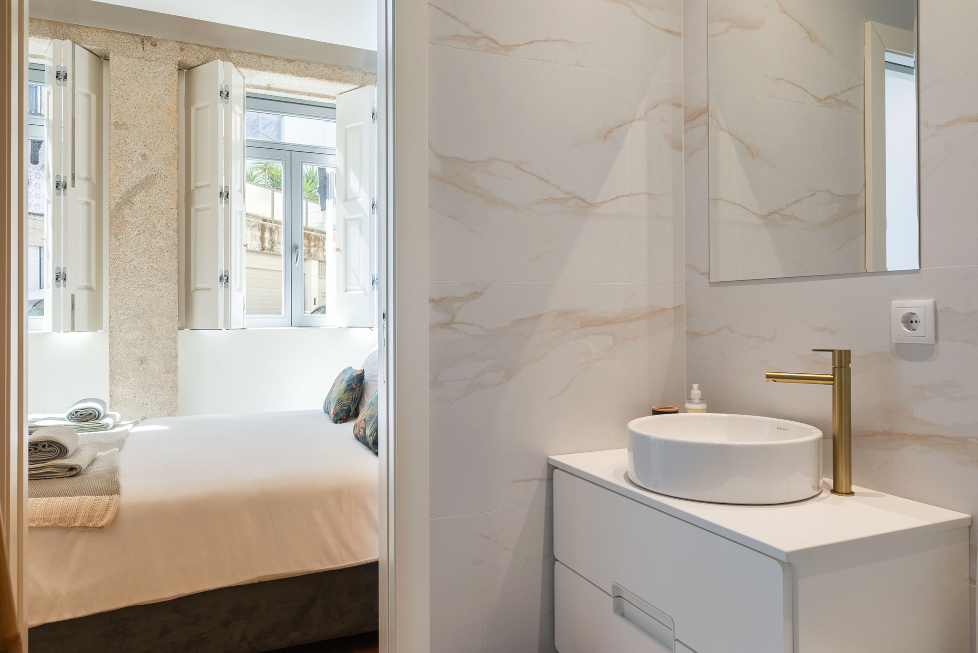 Marble bathroom with gold fixtures