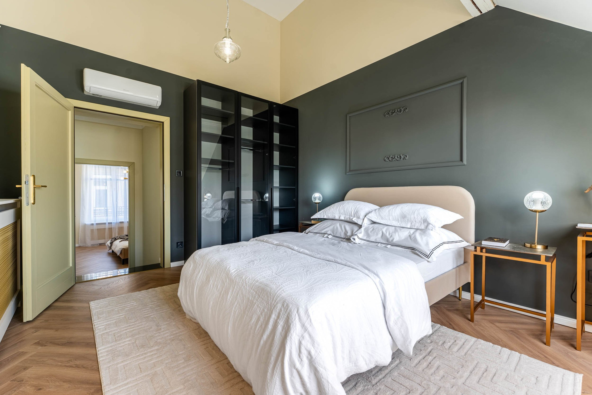 Dark green bedroom with wardrobe