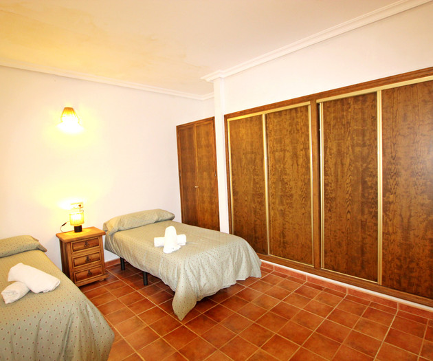 Twin bedroom with wardrobe