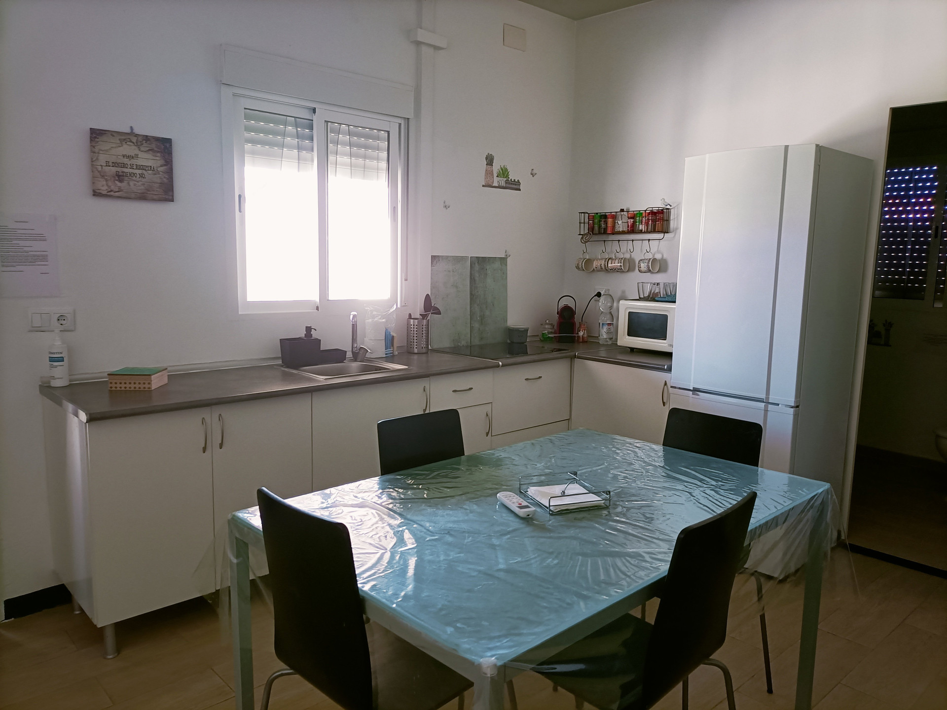 Kitchen with dining table and fridge