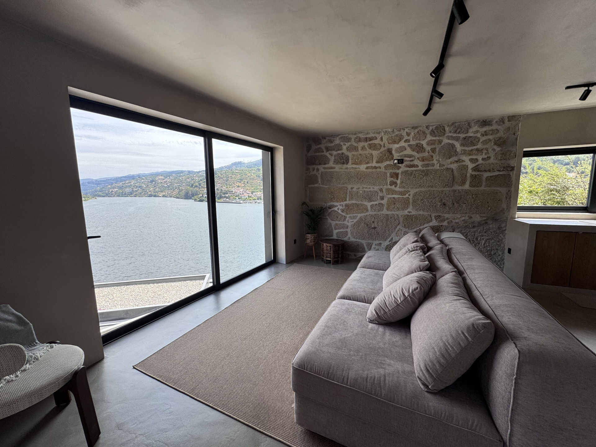 Living room with sofa, panoramic window