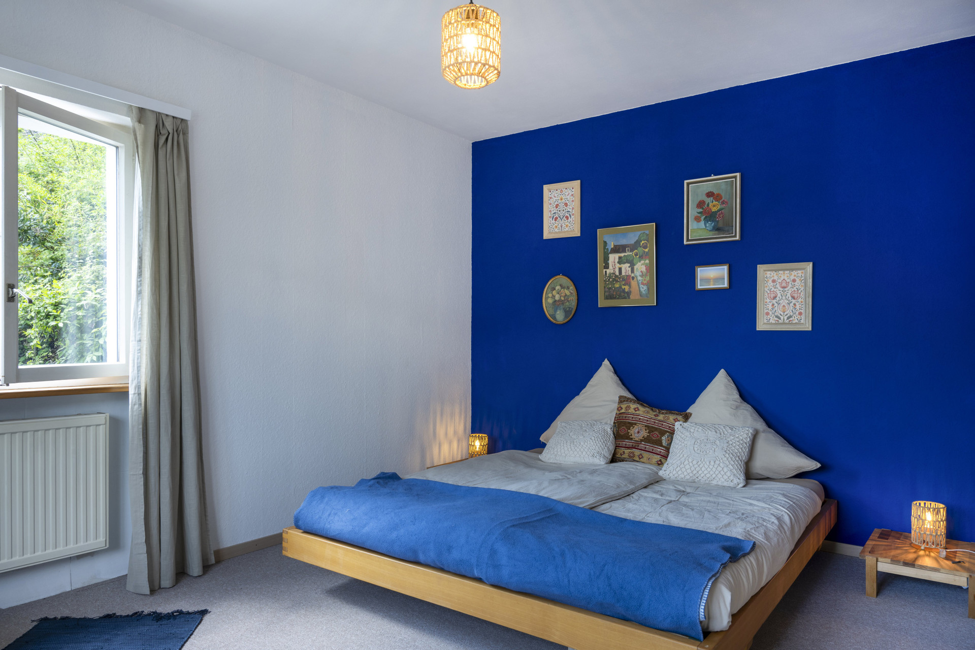 Bedroom with bold blue accent wall