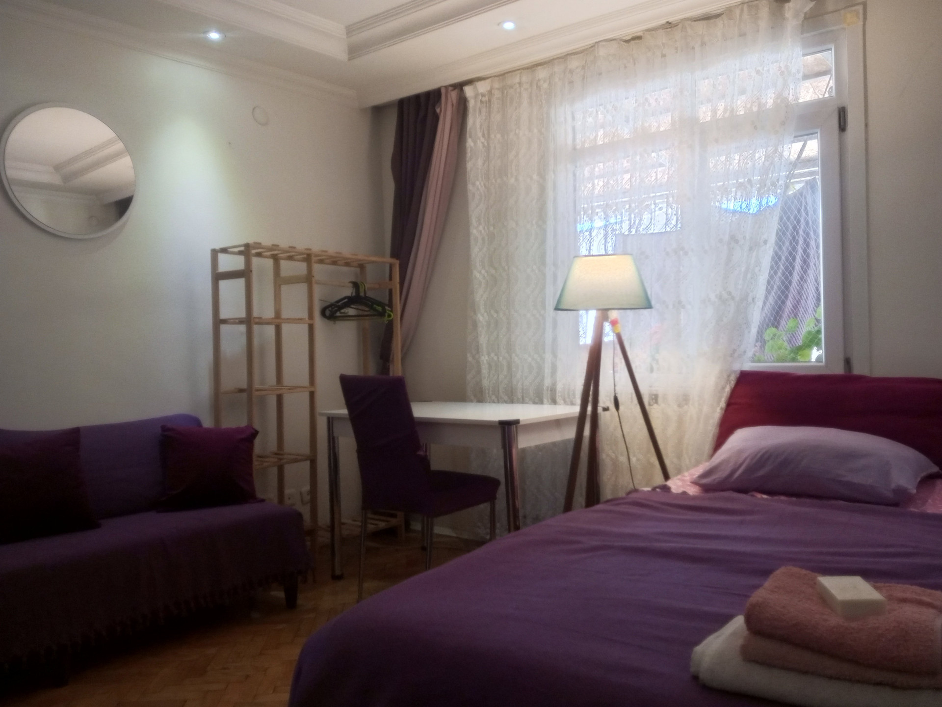 Bedroom with sofa and bed