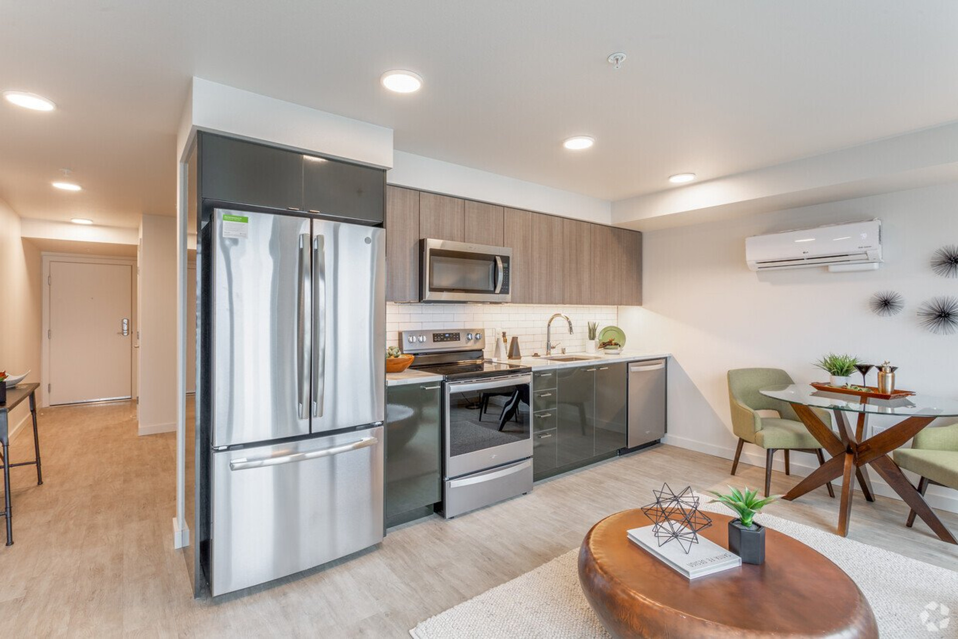 Kitchen with stainless appliances and dining