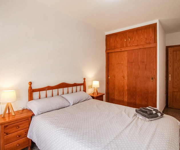 Bedroom with wooden wardrobe