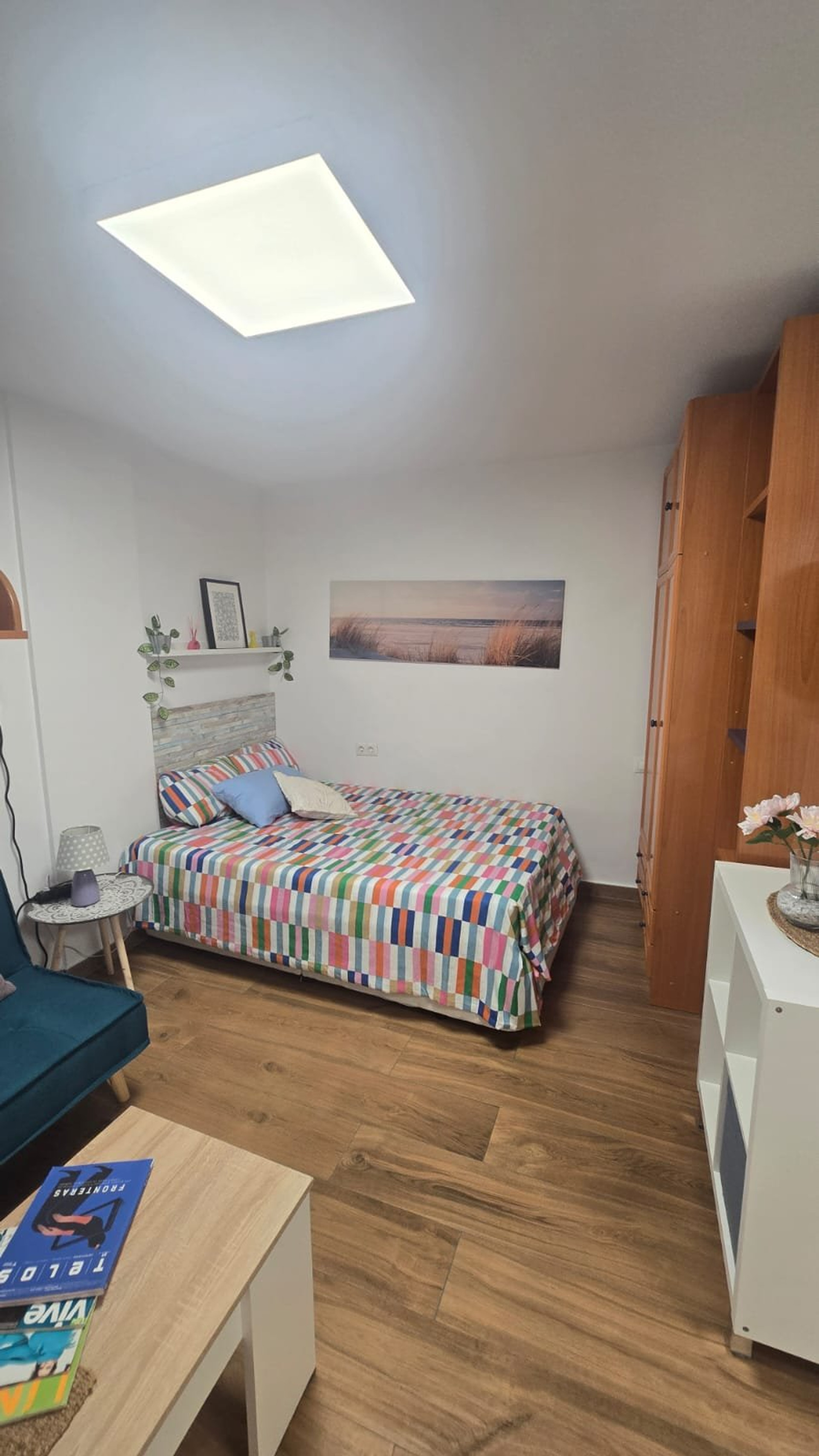Bedroom with colorful bedspread