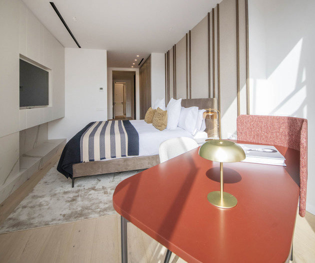 Bedroom with desk foreground