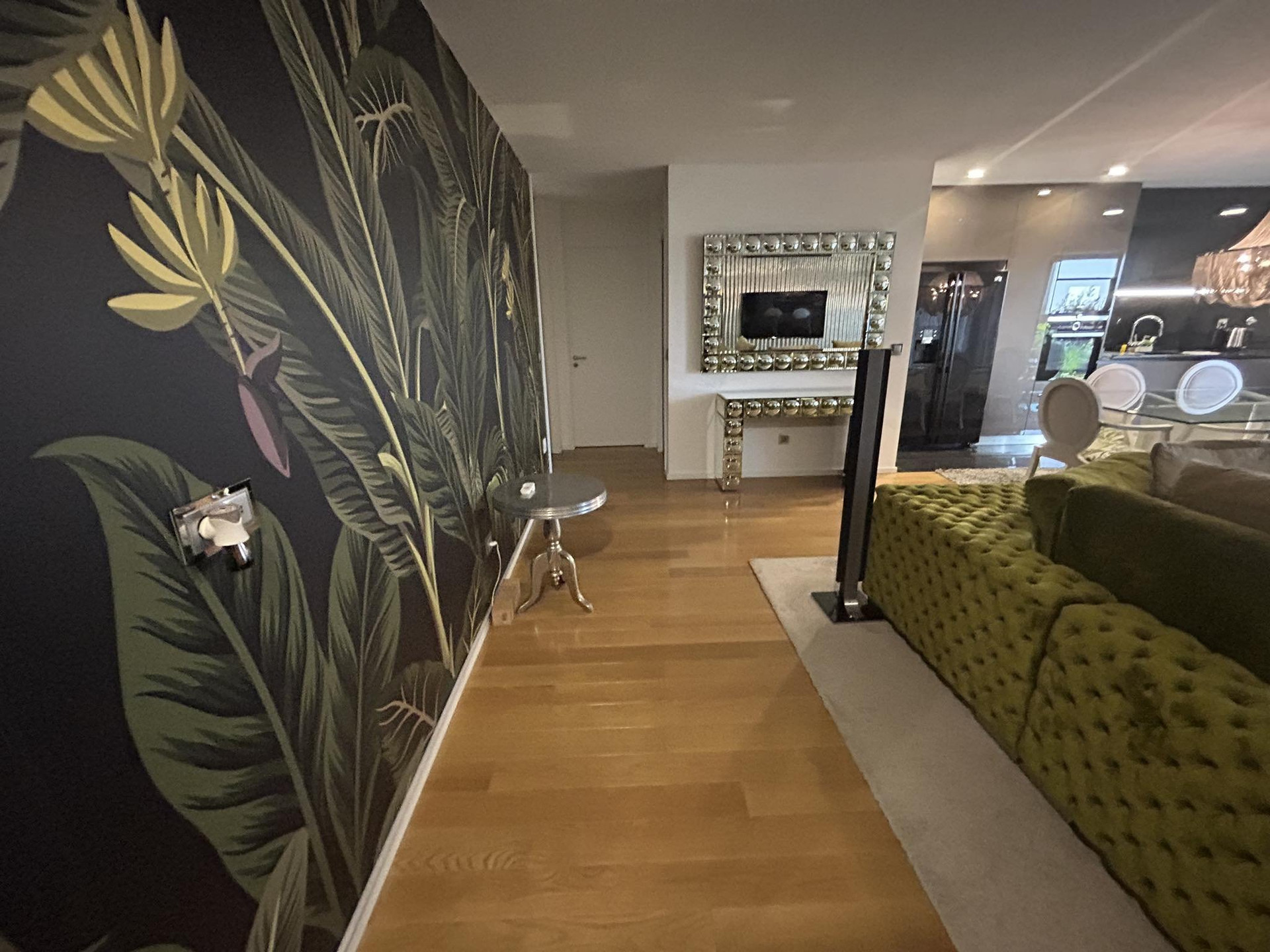 Living area with jungle wallpaper