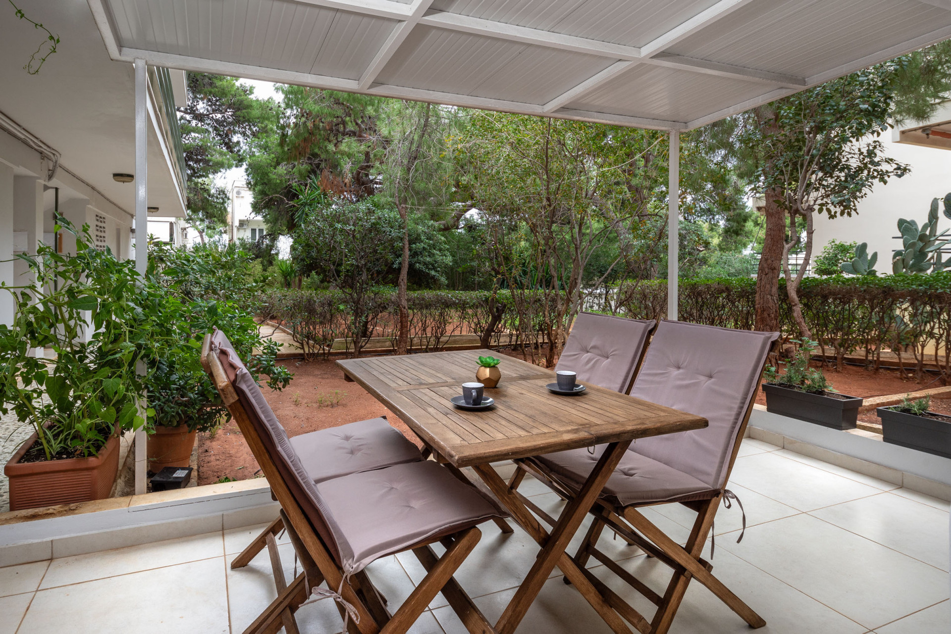 Patio with outdoor furniture and garden.