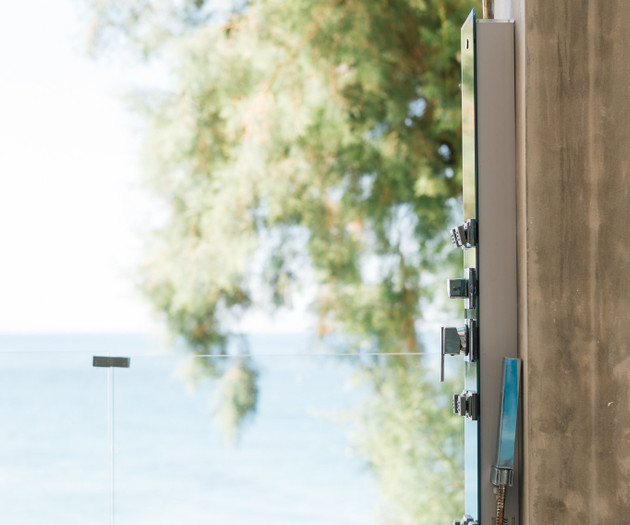 Outdoor shower with sea backdrop