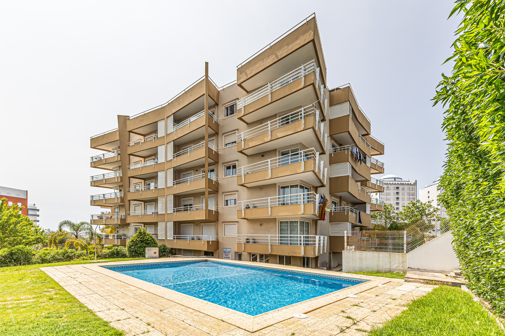 Building exterior with pool view