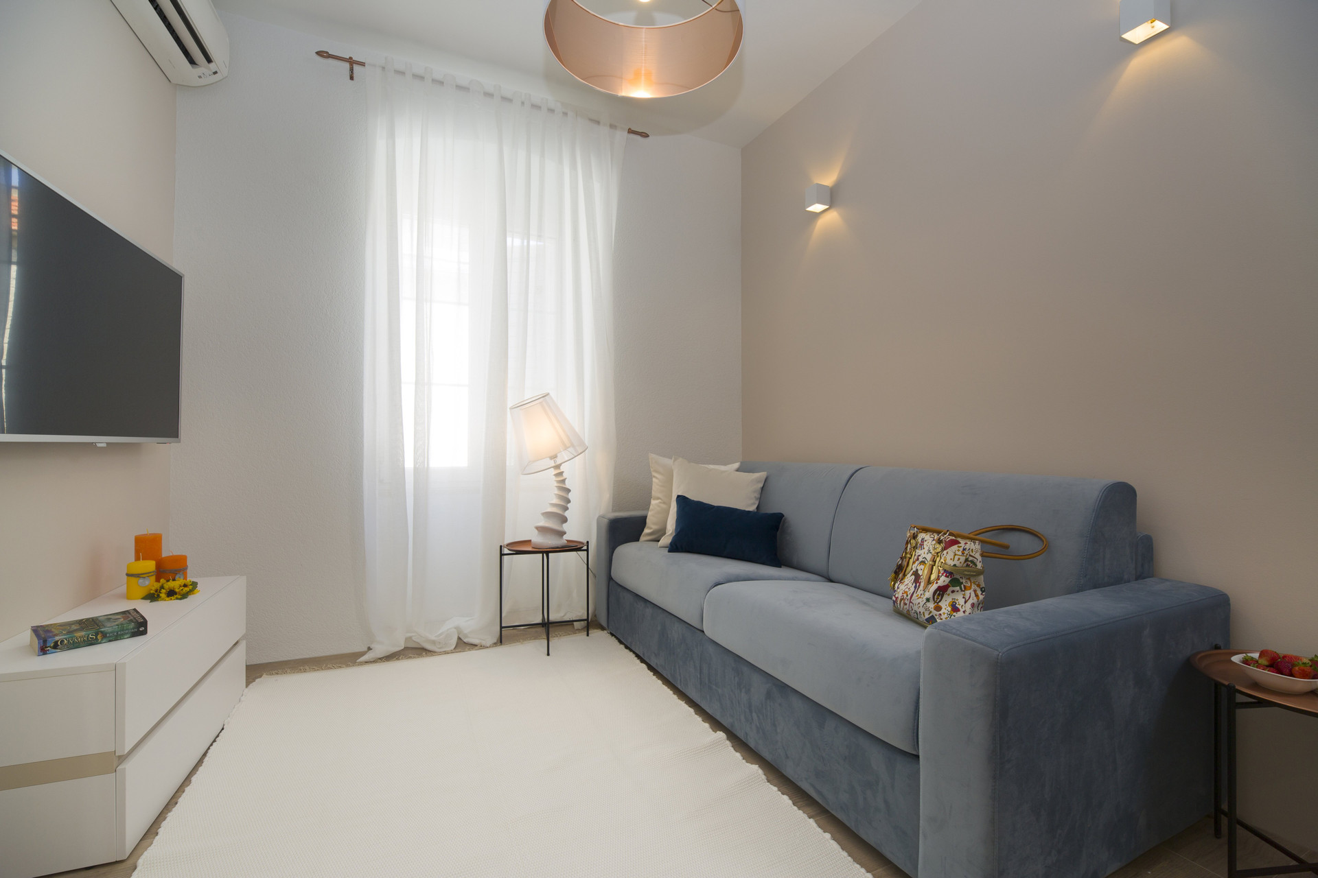 Bright and airy dining space featuring a comfortable sofa for relaxing after a day of exploring.