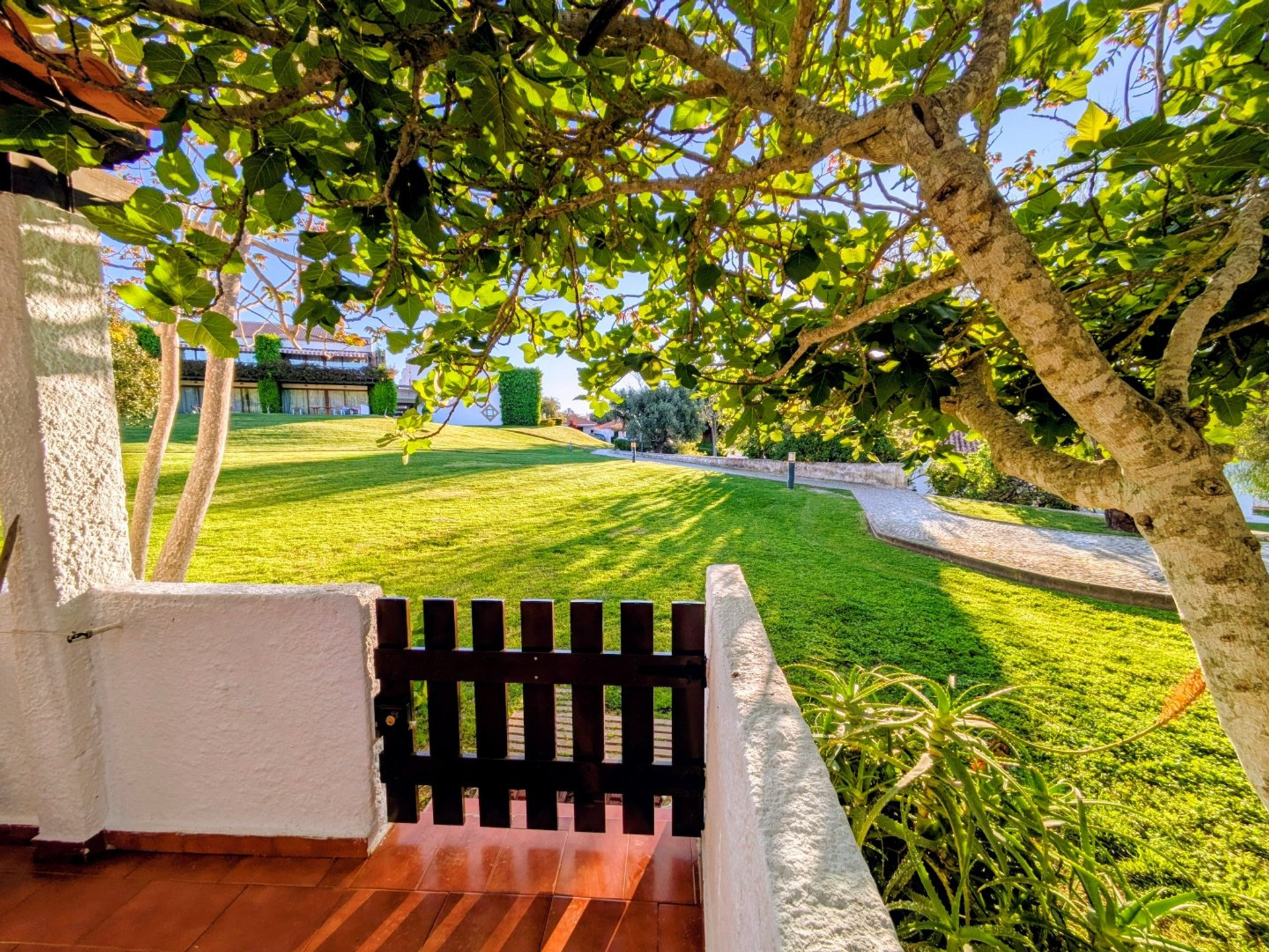 Terrace gate overlooking lush garden