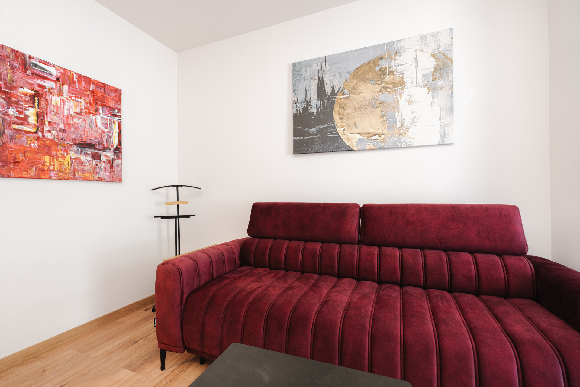 Red sofa and abstract art