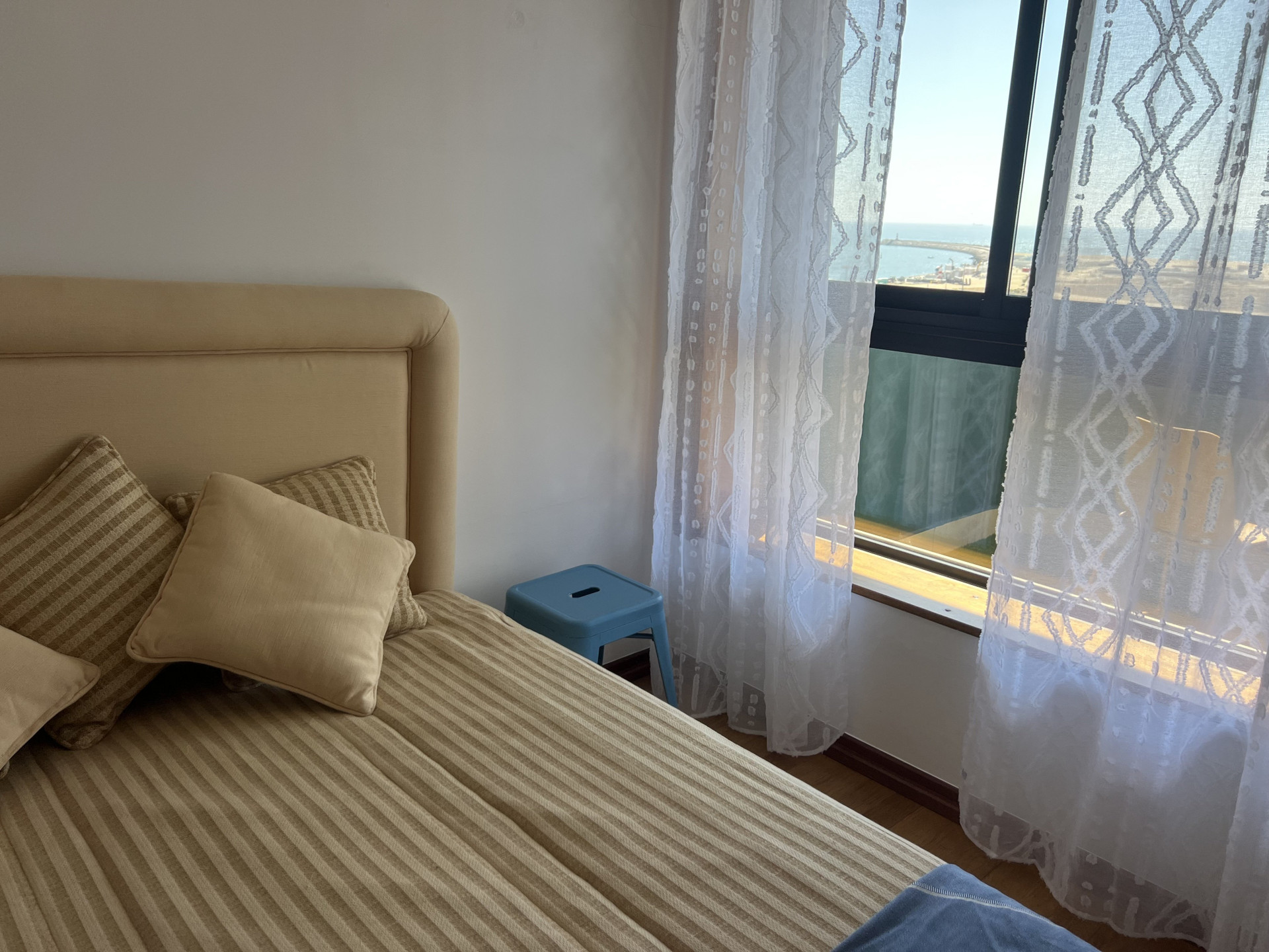 Bedroom with ocean view window