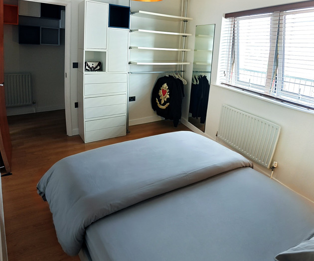 Bedroom with wardrobe and shelving