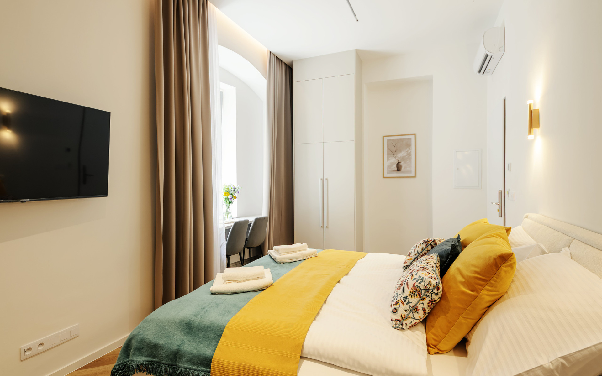 Bedroom with TV and wardrobe
