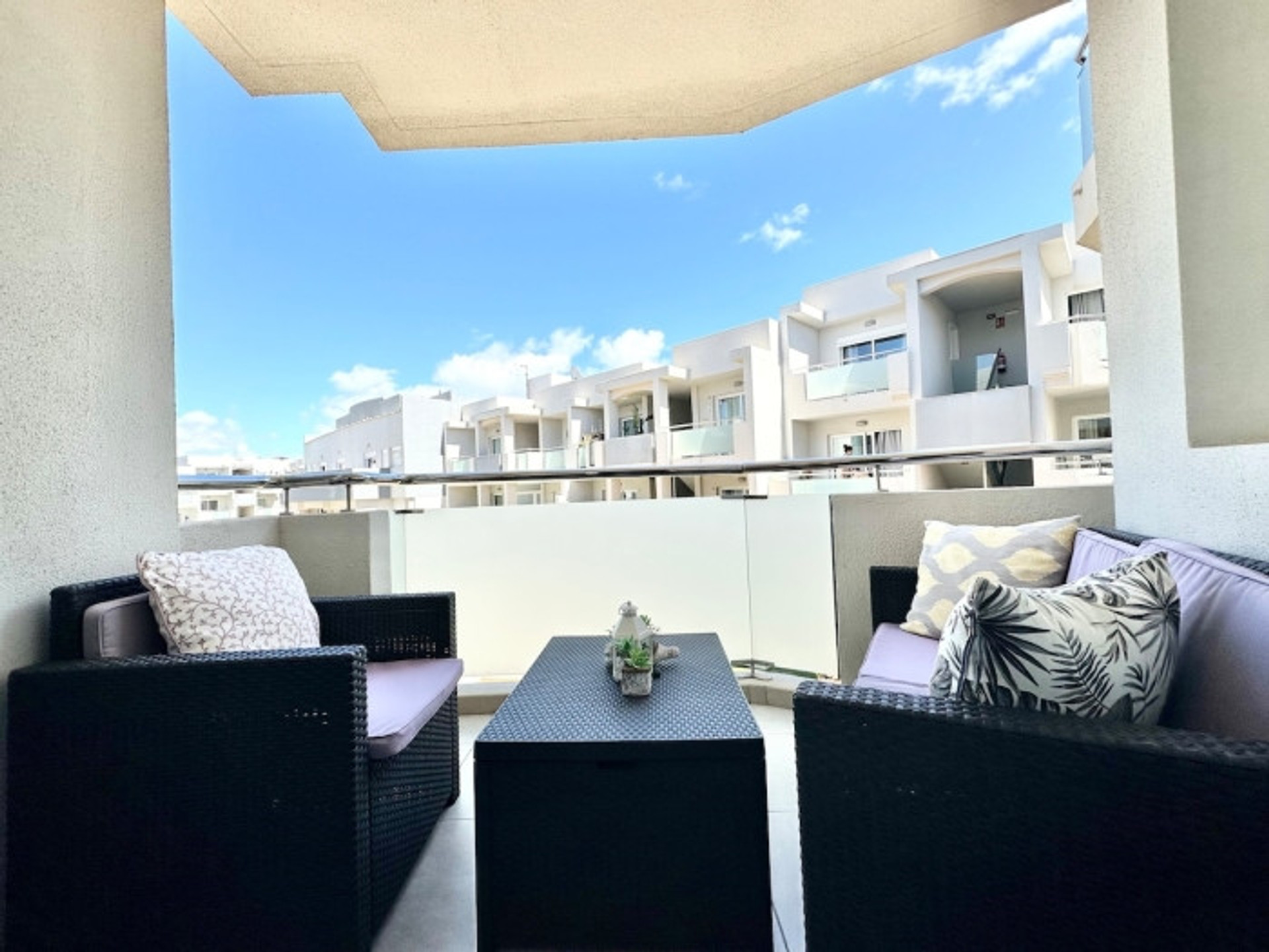 Terrace with outdoor seating set facing pool