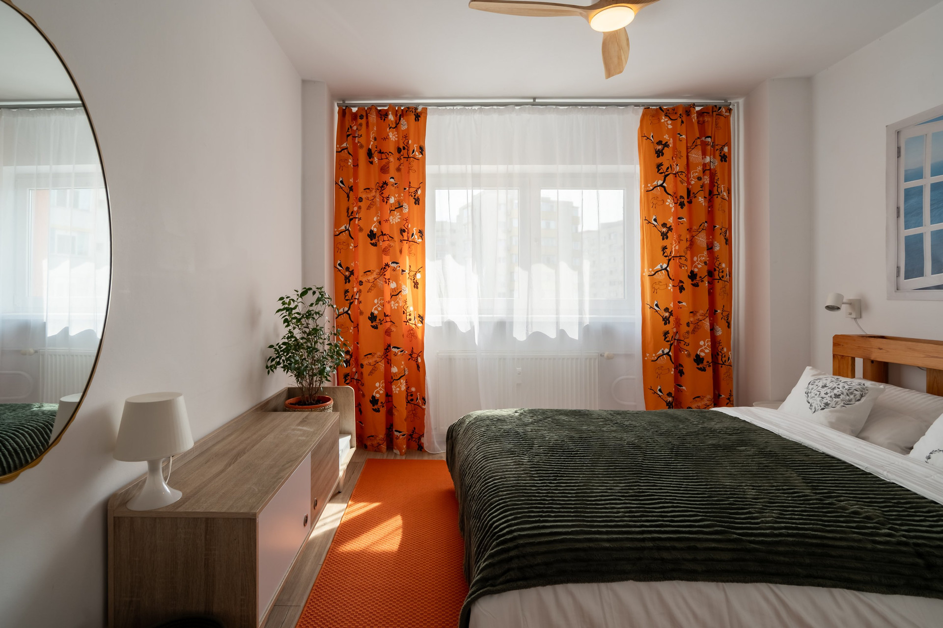 Bedroom with orange curtains