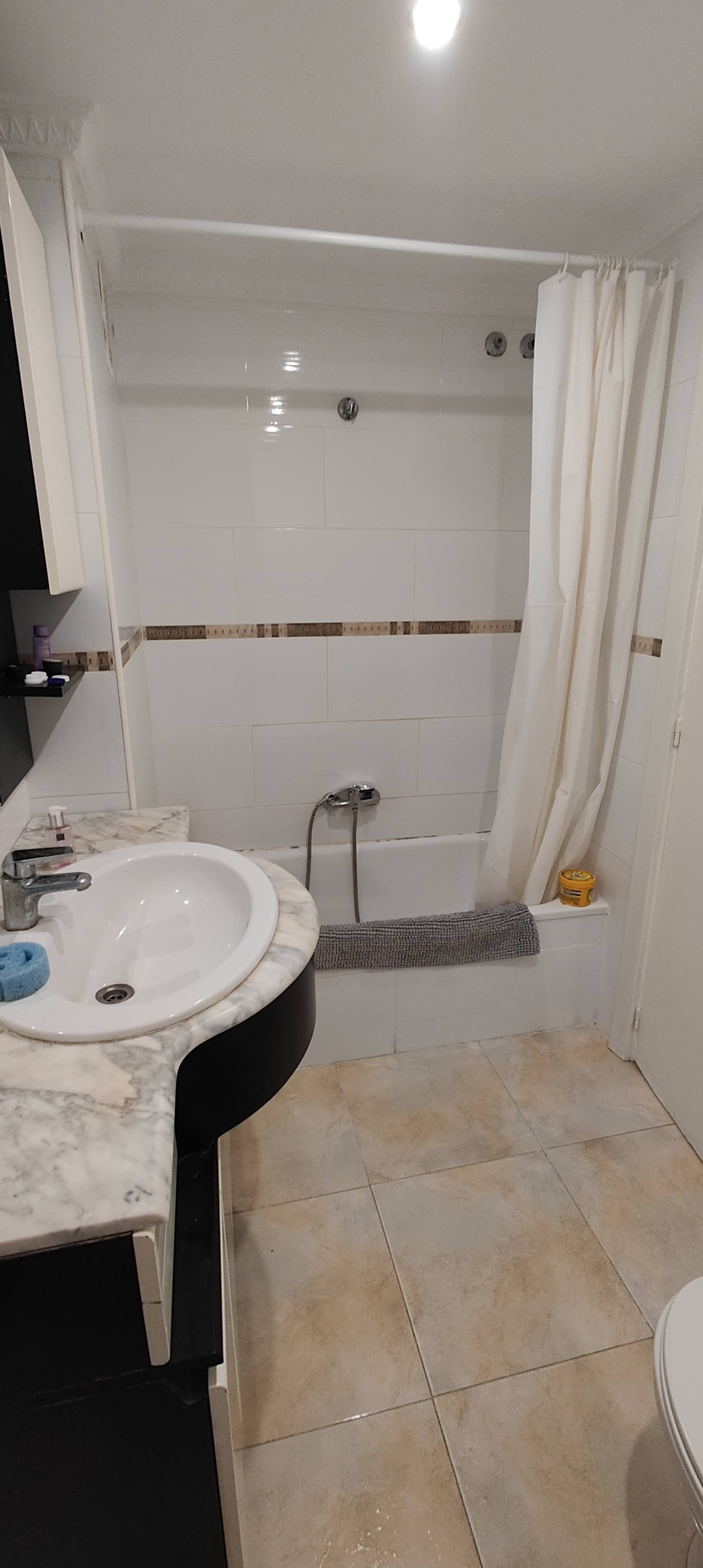 Bathroom with bathtub and sink