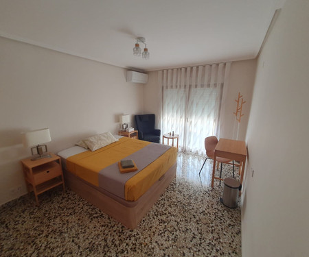 Large furnished room with balcony