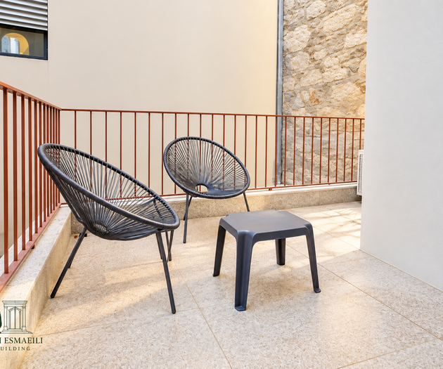 Terrace with railing and chairs