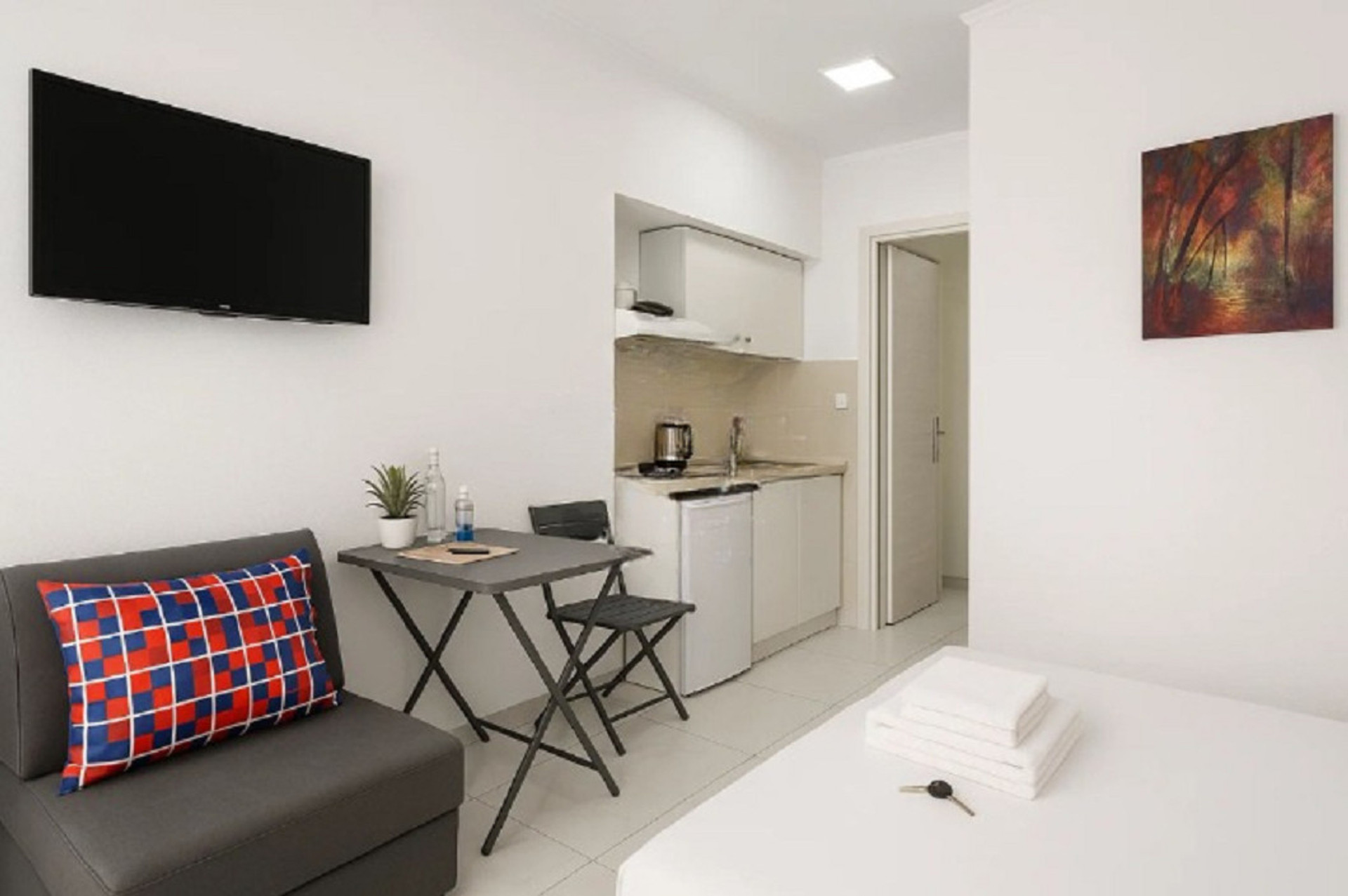 Compact cooking area with essential amenities, perfectly integrated into the apartment's layout