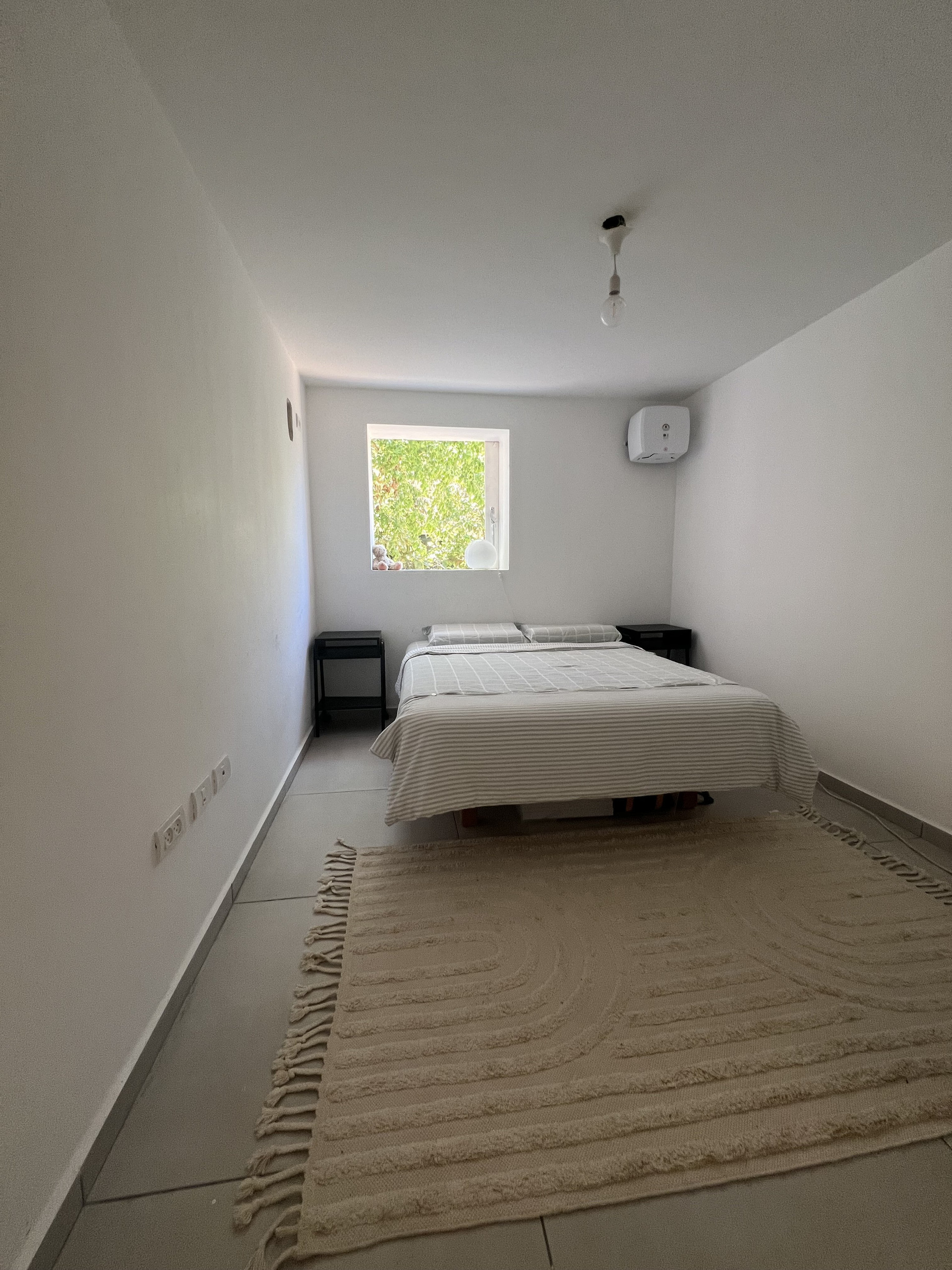 Bright bedroom with double bed