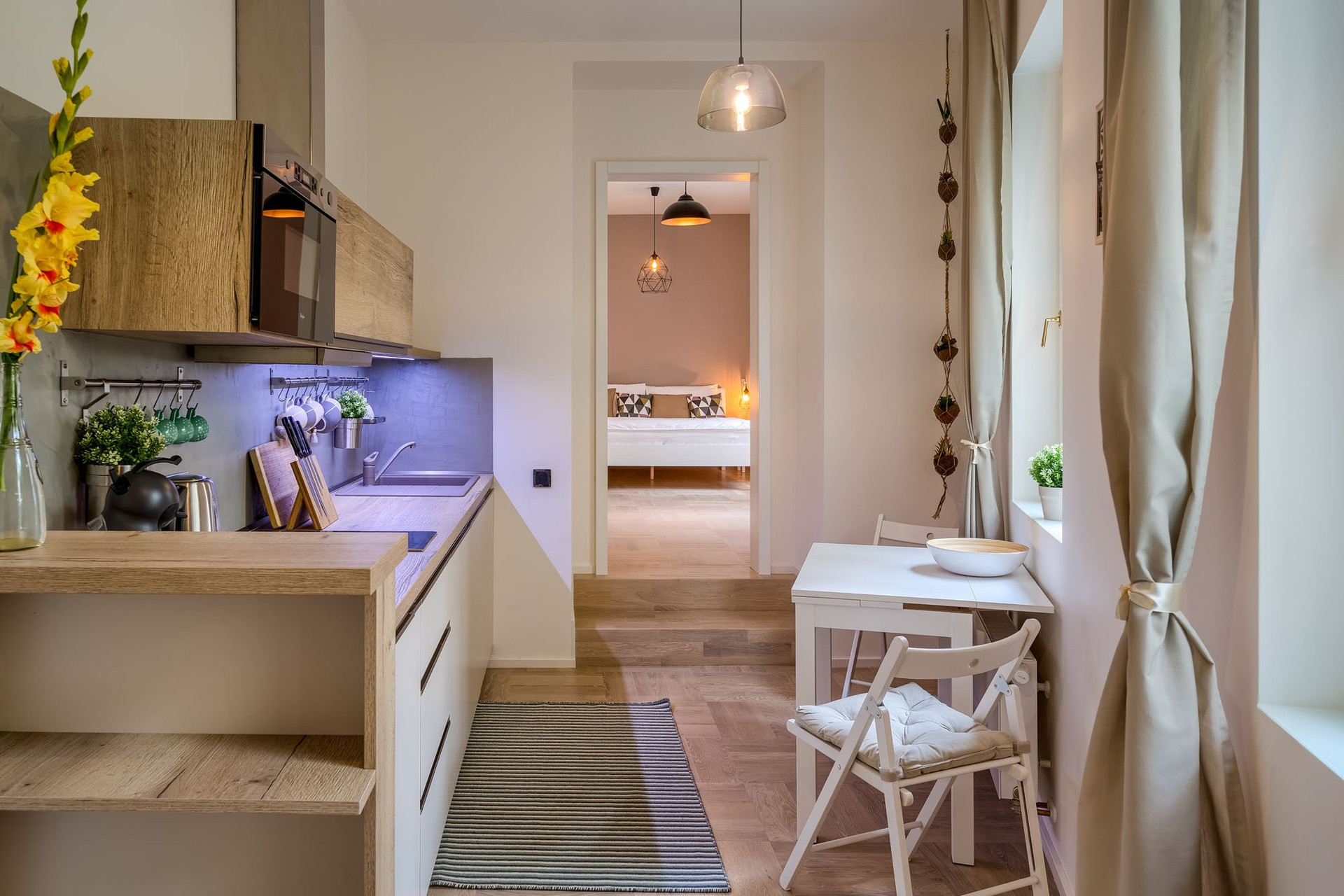 Kitchen with dining nook and hallway