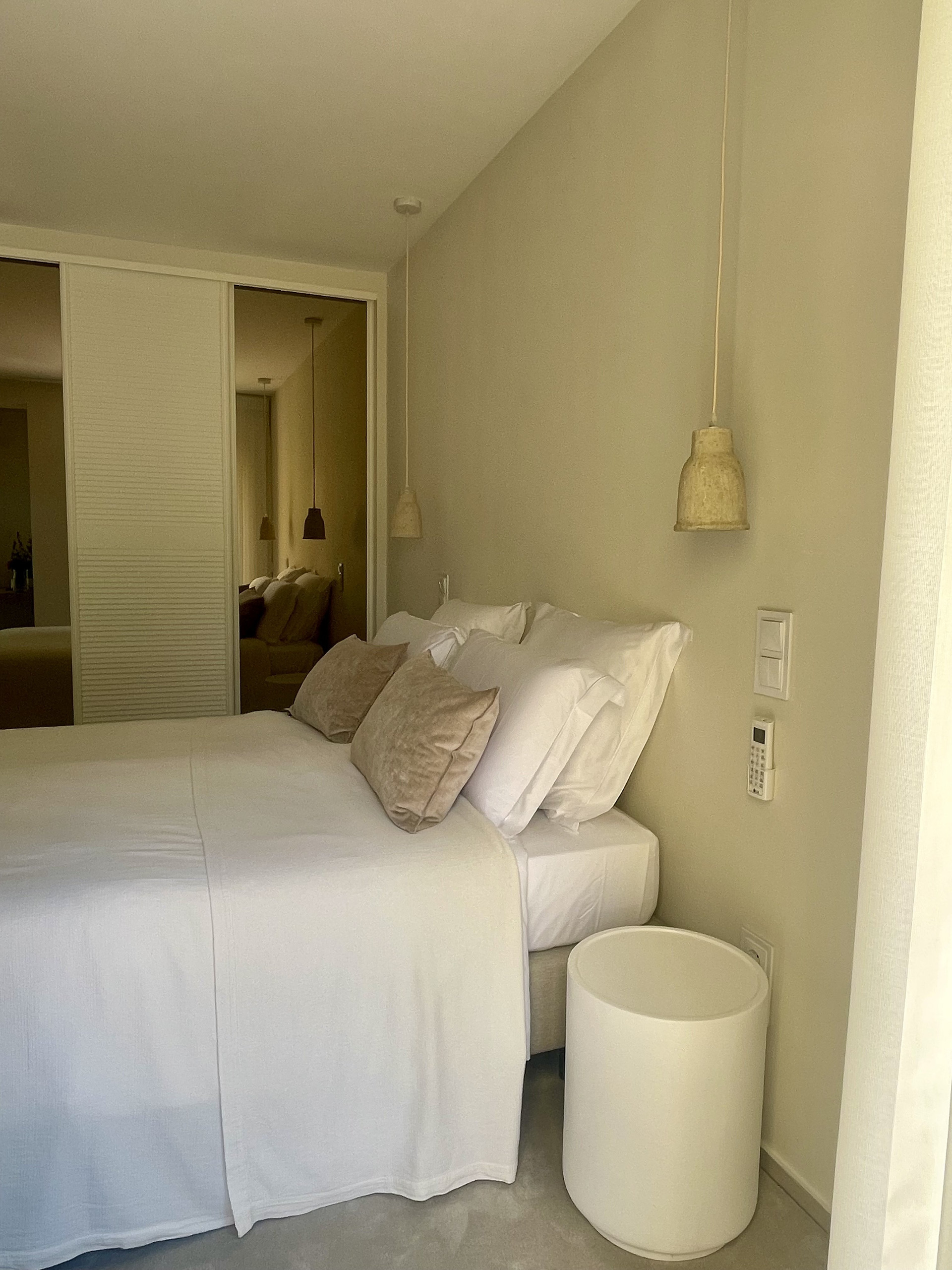 Comfortable queen-size bed with premium linen