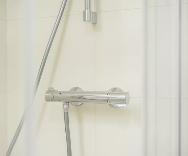 Shower thermostat control detail