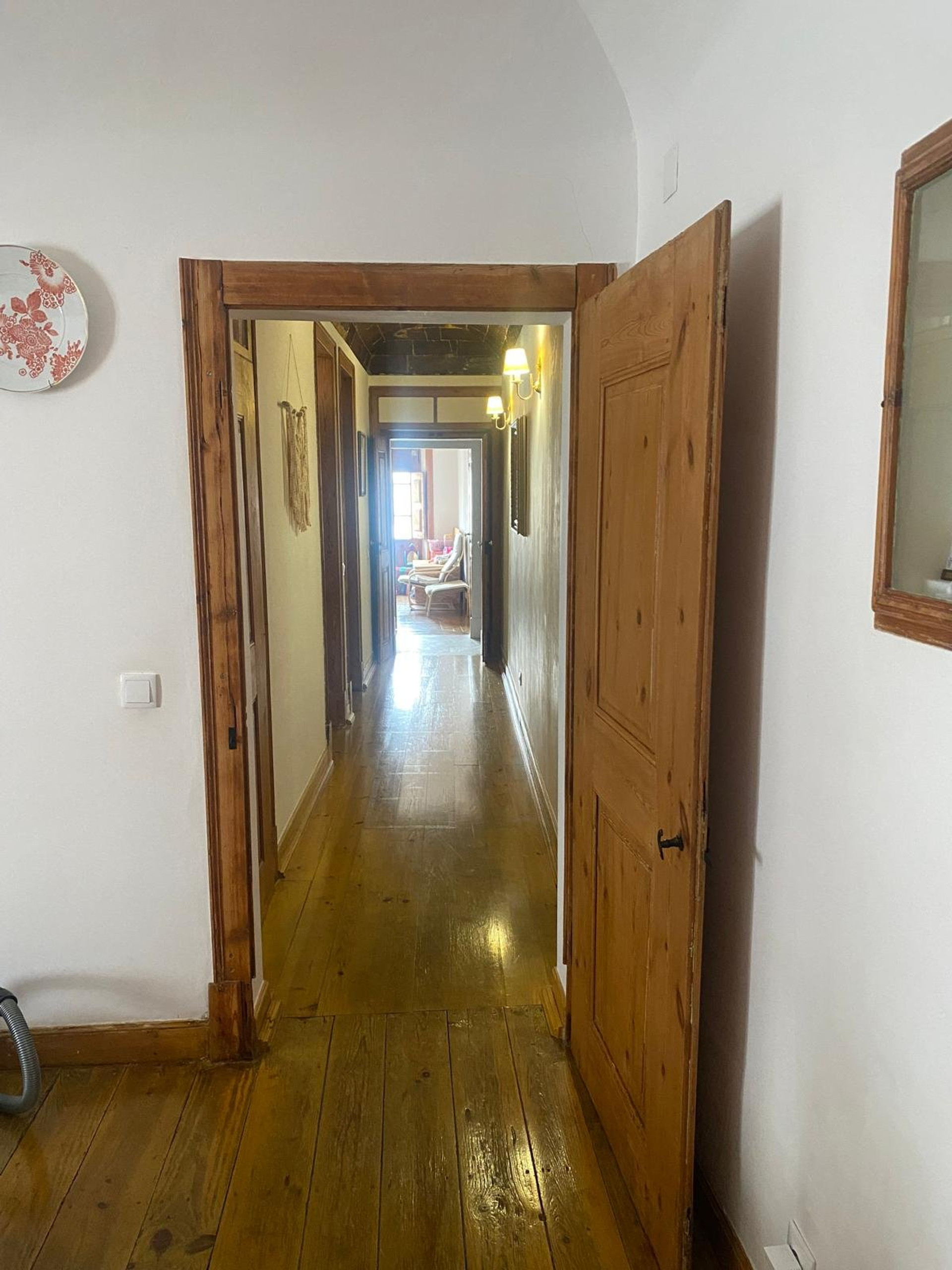 Hallway entrance with wooden flooring