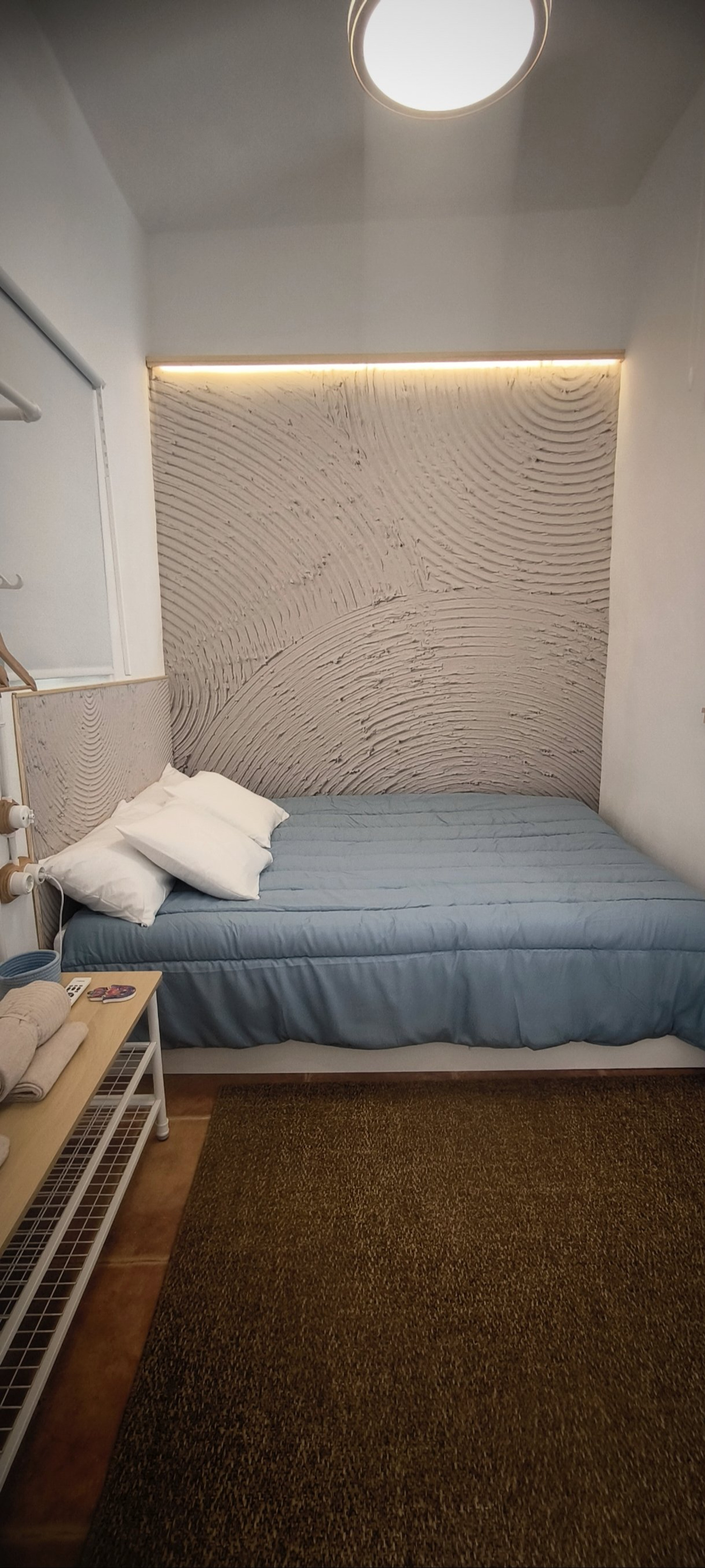 Bedroom with textured accent wall