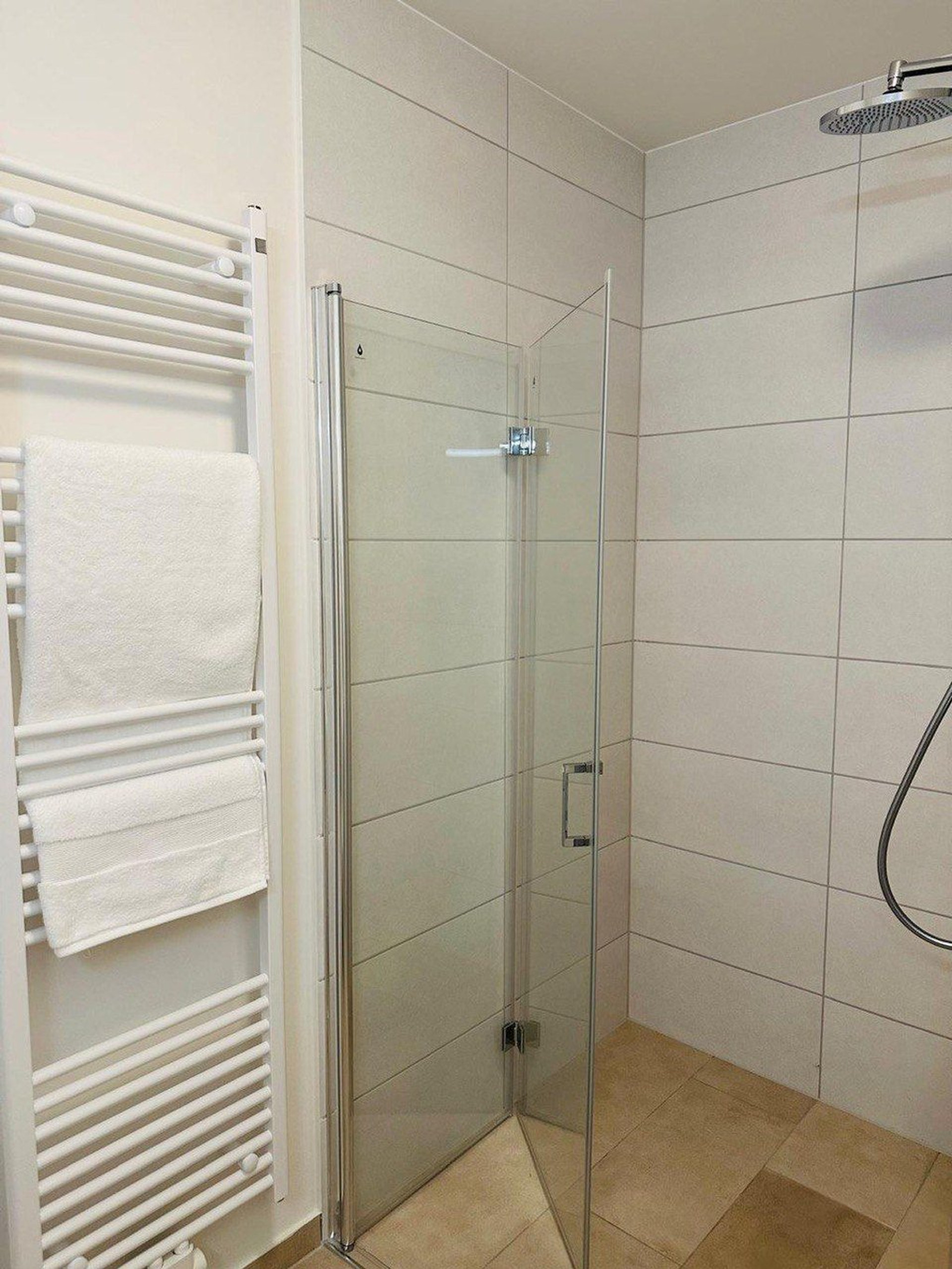 Clean bathroom with glass shower