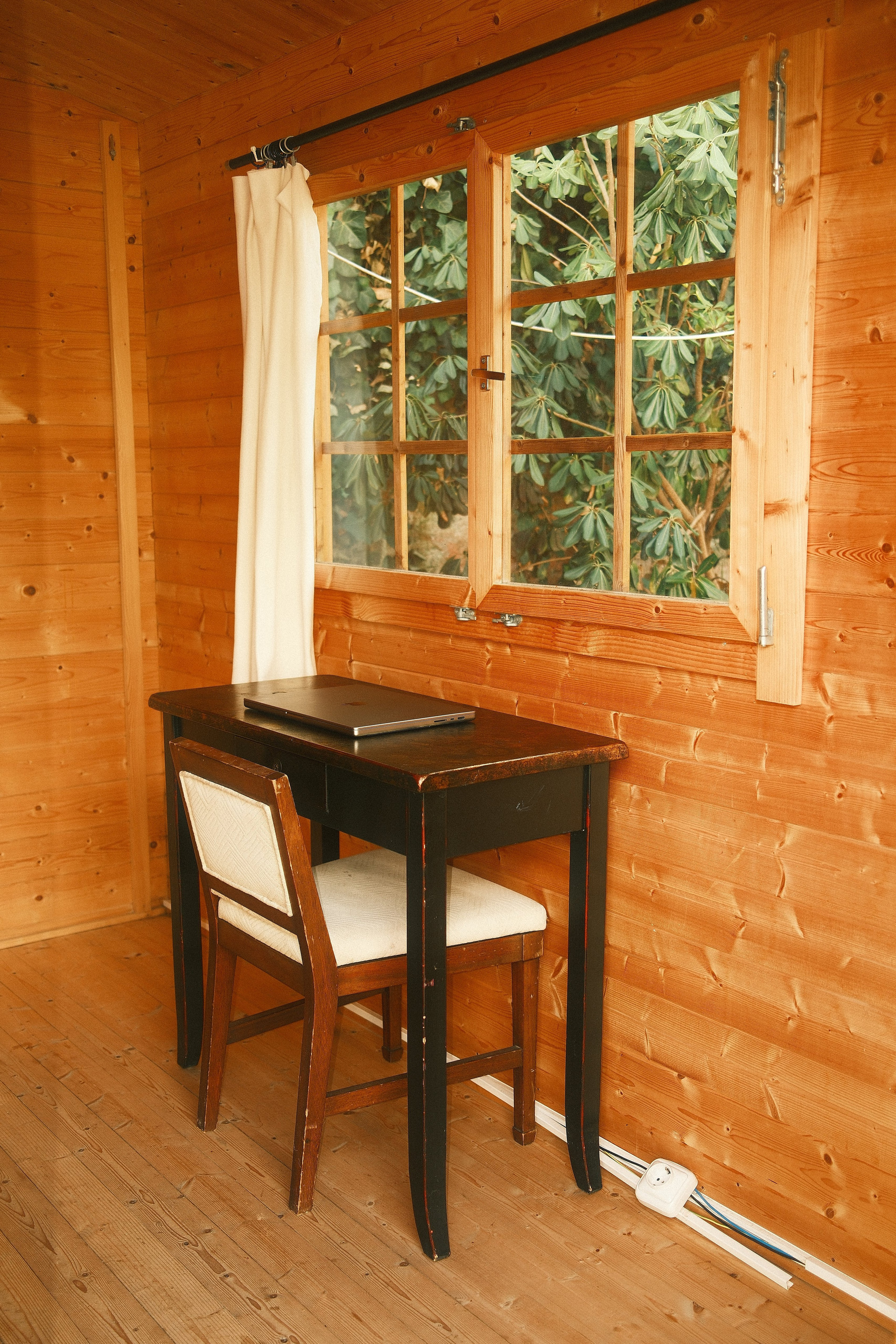 Desk and chair by window