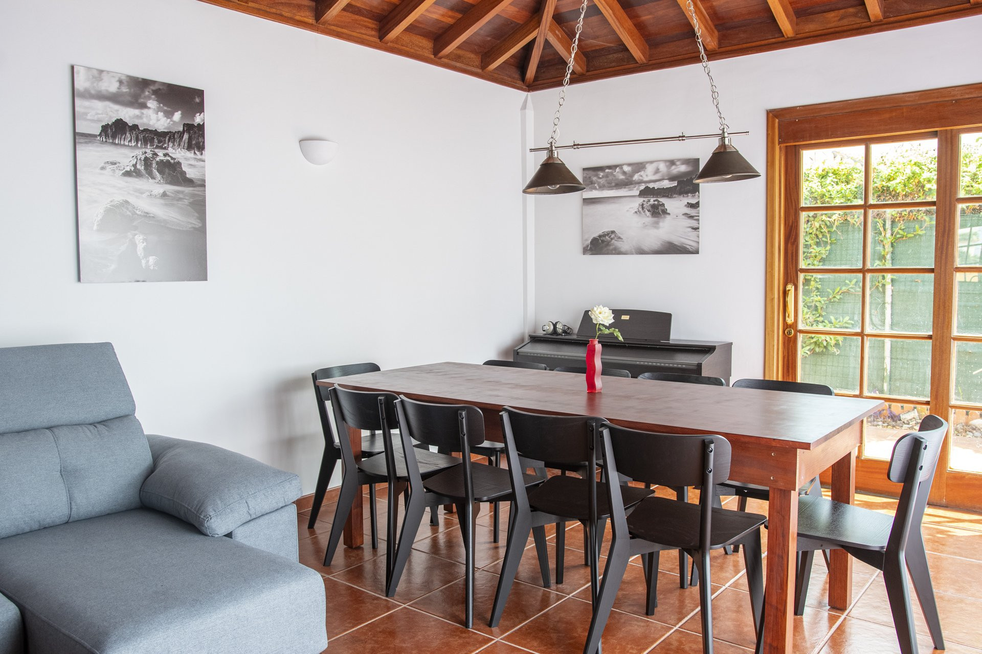 Dining room with piano and art