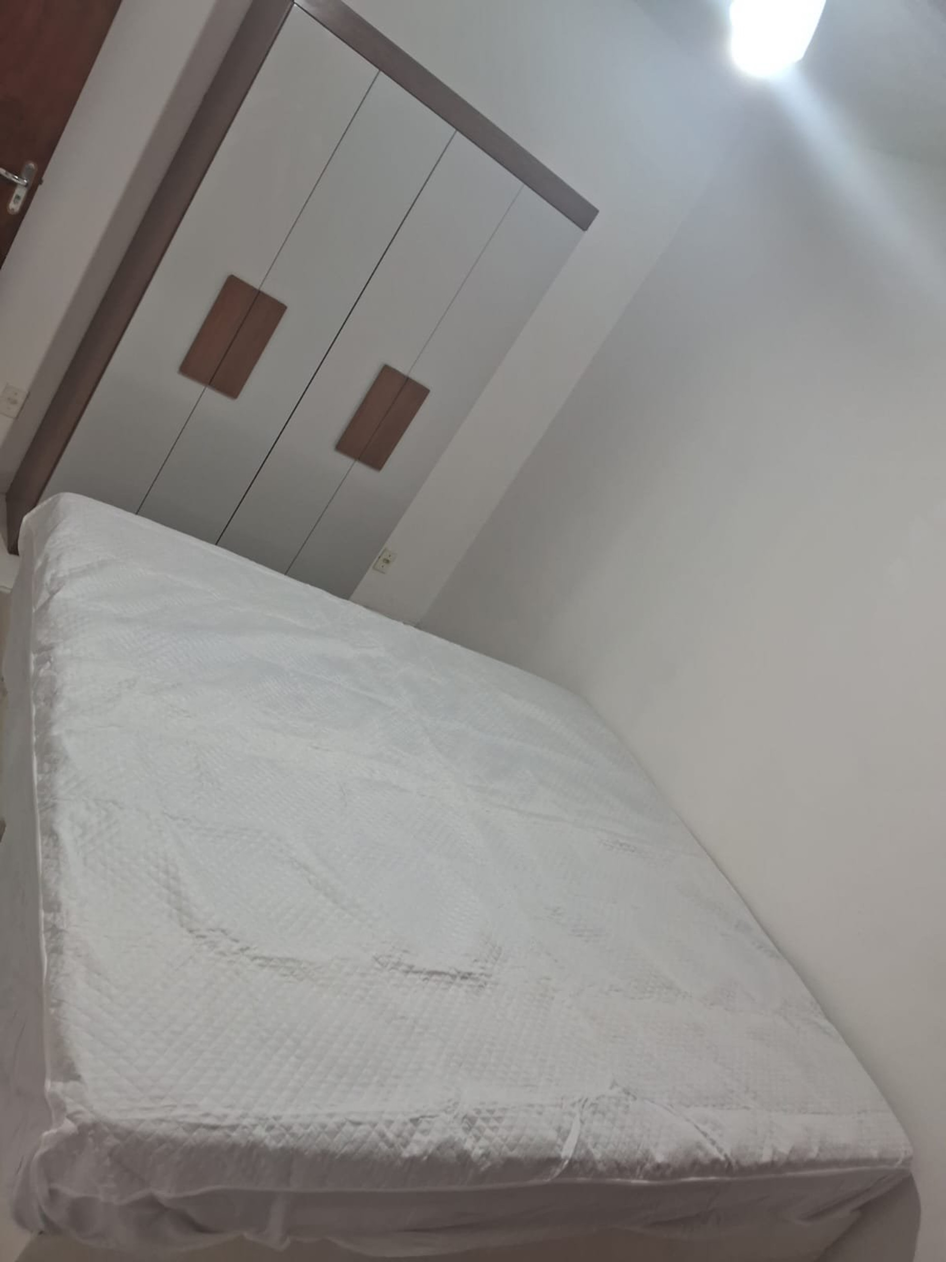 Bedroom with double bed and wardrobe